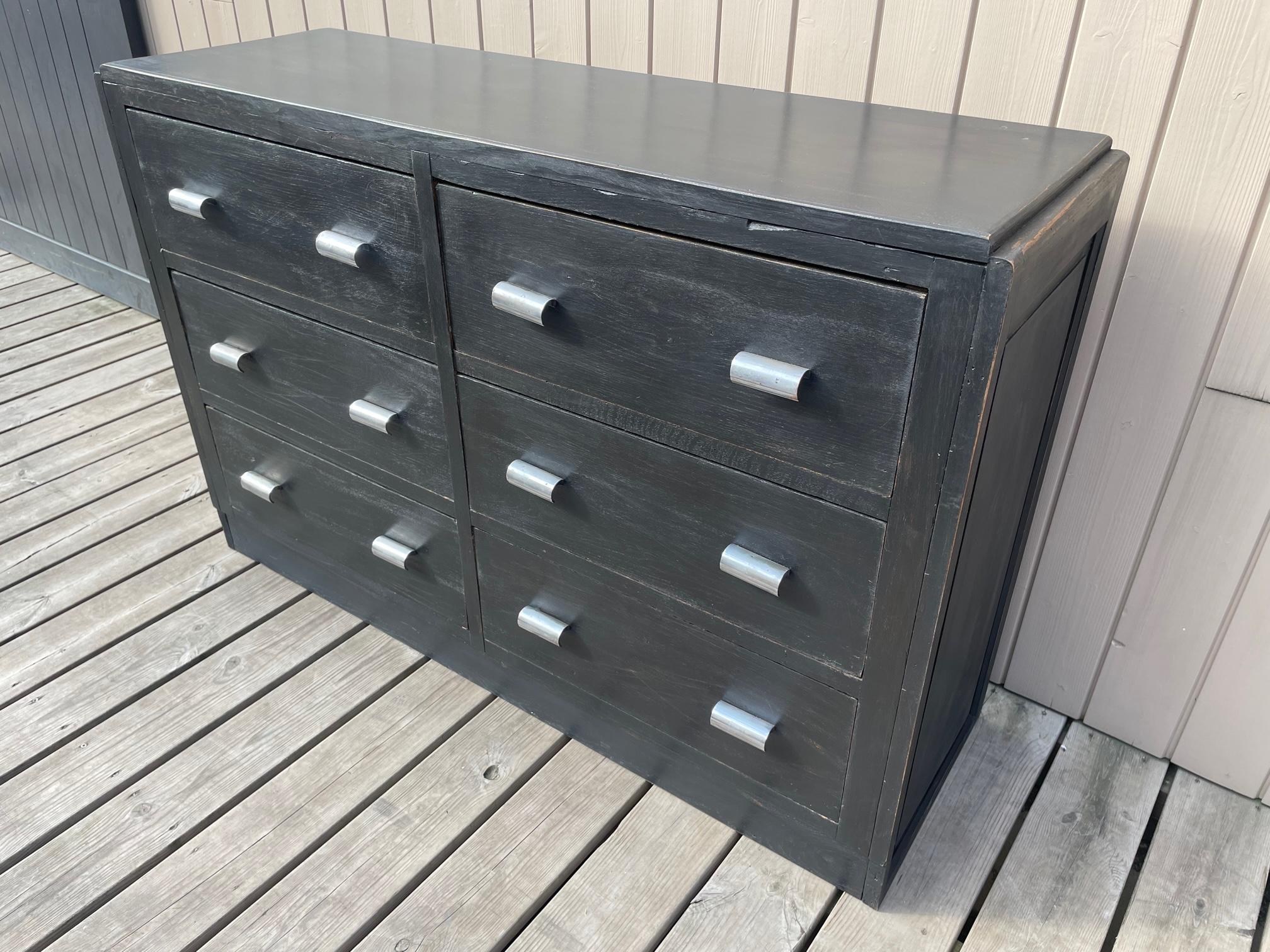 Nice workshop cabinet with drawers painted in black from the 1940s in good condition. Chromed metal handles. Ideal in a kitchen or living room. 
Vintage or industrial decoration.