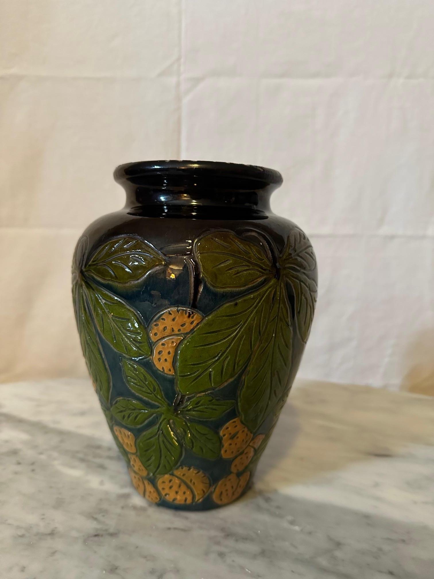 Beautiful glazed terracotta vase dating from the 1940s in good condition (Slight chips on the neck of the vase).
Comes from Savoie, Fauquet in Bonneville France. 
Walnut decoration on a blue background.