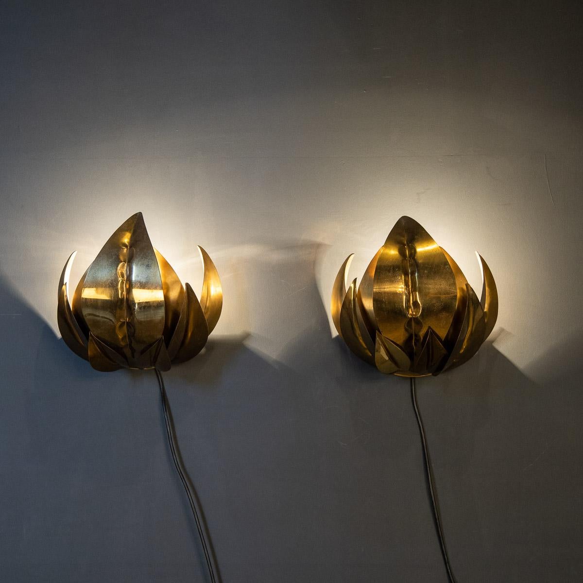 An unusual pair of brass wall sconces attributed to Maison Jansen. Particularly well made these lights are in the form of natural closed leaves, circa 1970 this pair have been rewired for use in the UK.

CONDITION
In Good Condition - wear and tear