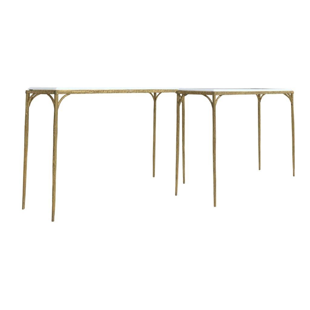 A vintage Mid-Century Modern pair of French console tables made of heavy gilded bronze frame in the faux bois design. The top was newly polished up, made of a white Thassos marble, in good condition. Wear consistent with age and use, circa 1950,