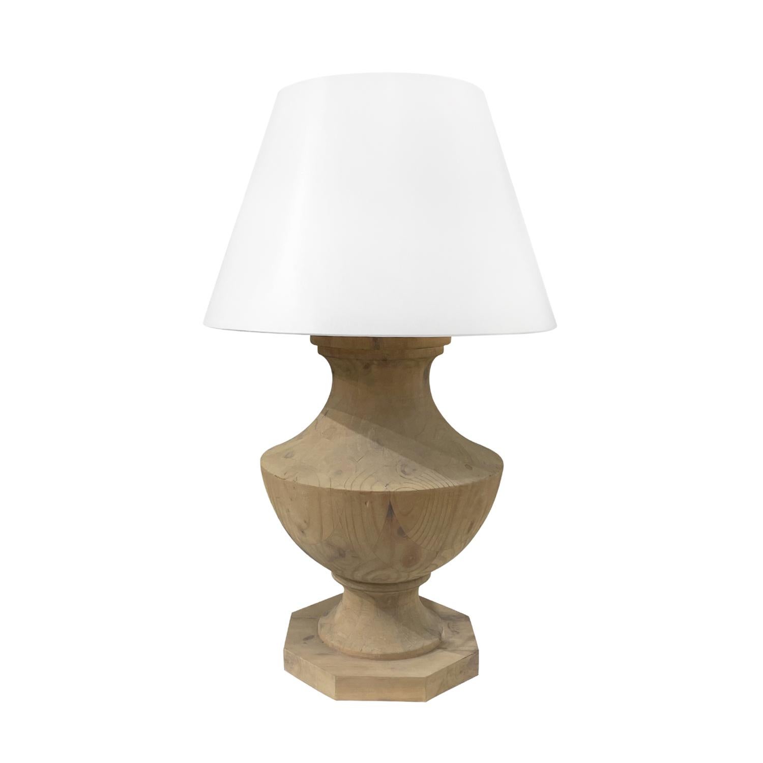 A vintage Mid-Century modern French pair of large table lamps with a new white round shade, made of hand crafted bleached Walnut in good condition. The baluster shaped lights are detailed with a polished brass finial, featuring a two light socket.