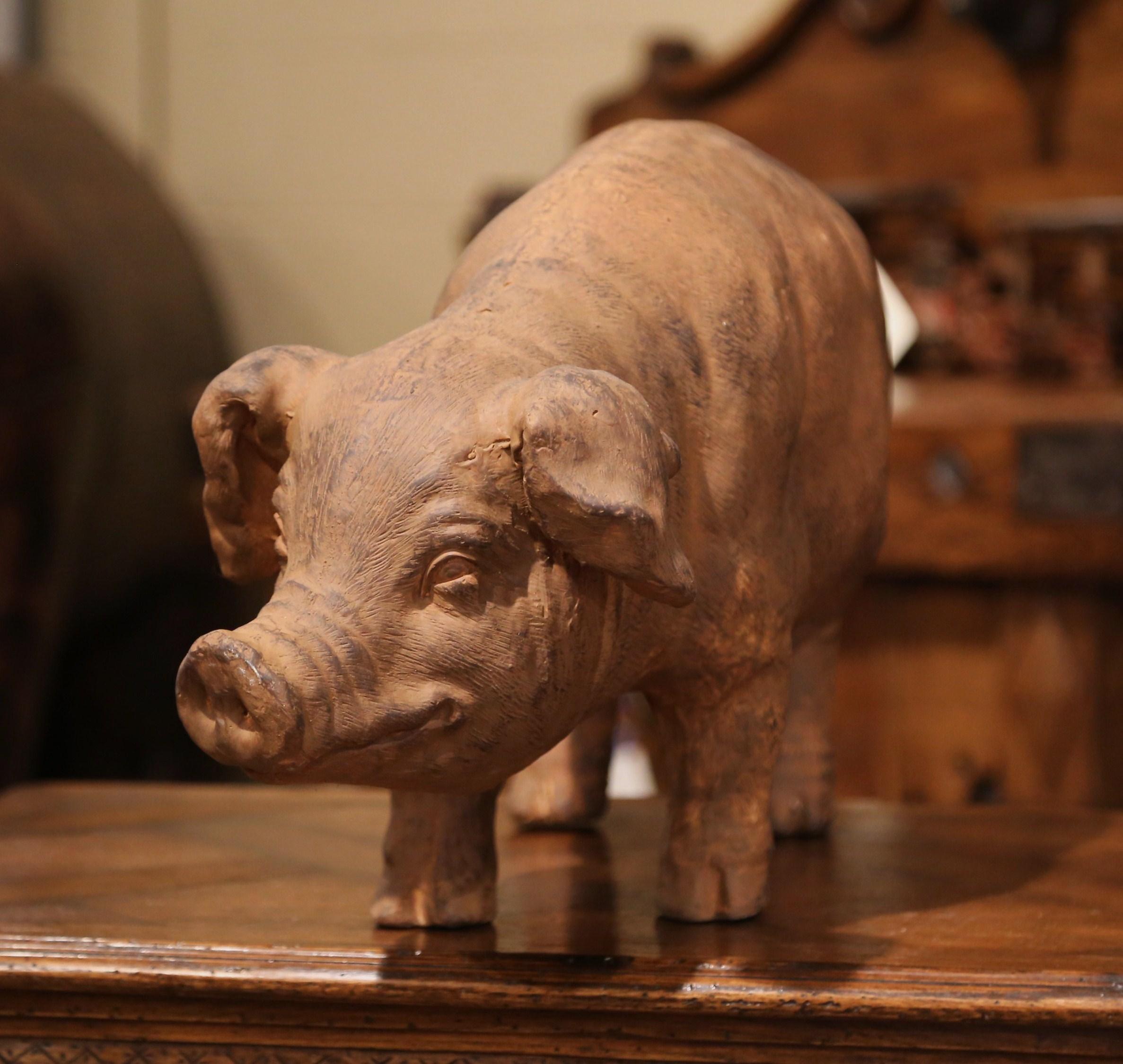 Decorate a kitchen counter or a patio with this large pig sculpture. Crafted in France, the ceramic pig features a nice patinated texture finish. The piece is in excellent condition.
Measures: 29