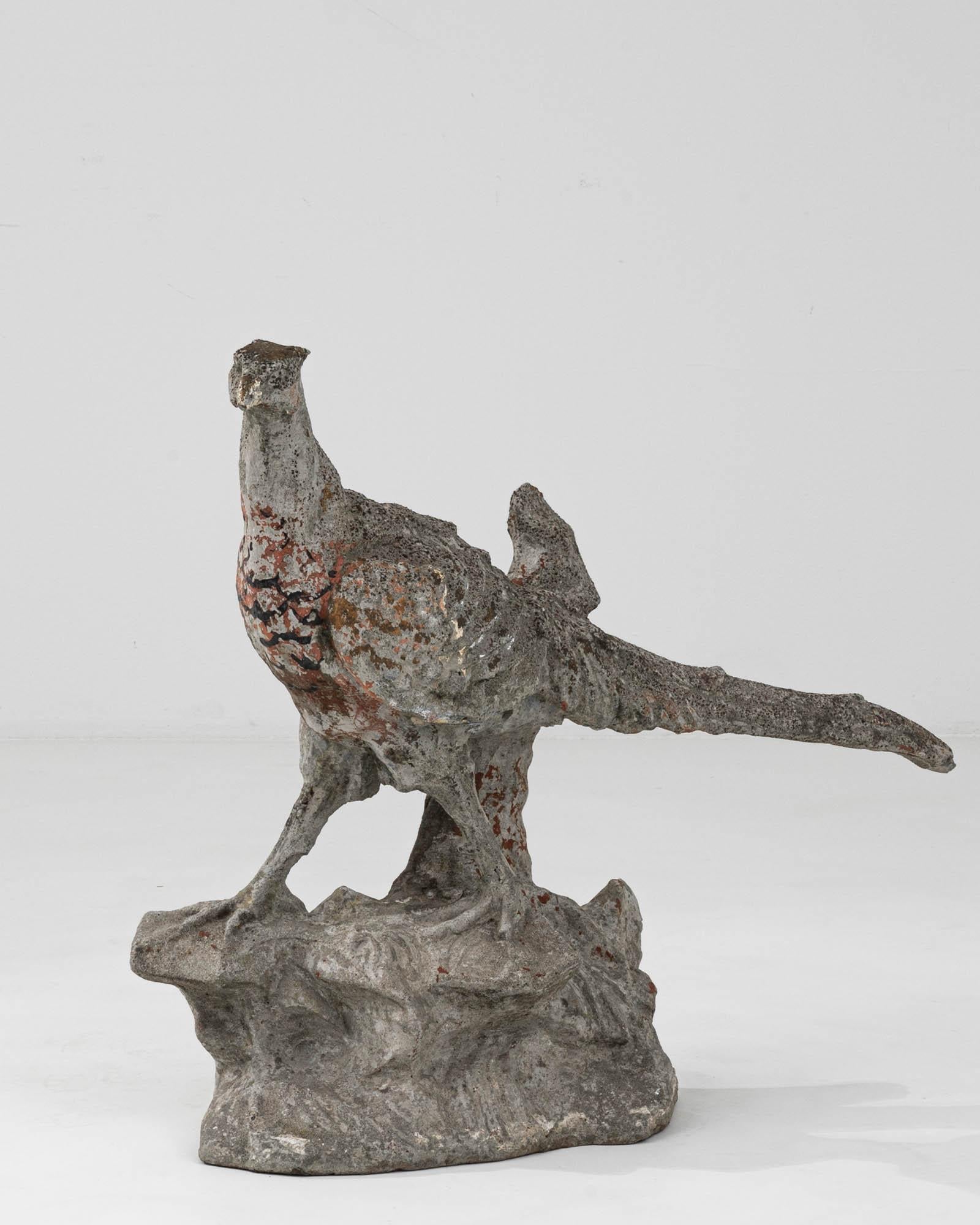 This 20th Century French Concrete Sculpture exudes a character that is both rustic and elegant. Sculpted with care, the bird form stands proudly, exhibiting an artistic balance of realism and abstraction that was popular in early modernist pieces.