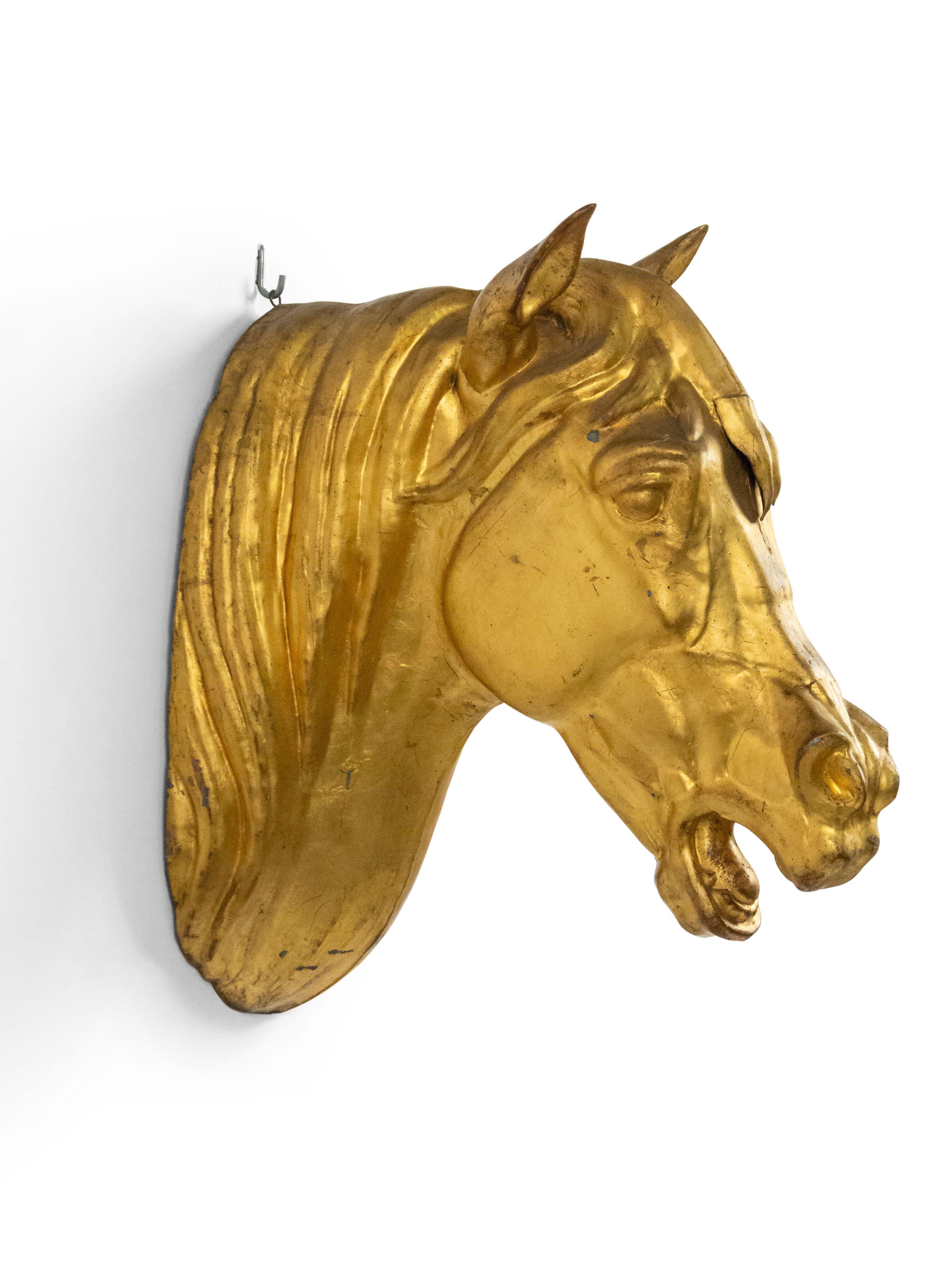 French Provincial (20th Century) wall plaque of gilt horse head butcher sign.
