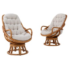 Vintage 20th Century French Rattan Swivel Armchairs, a Pair