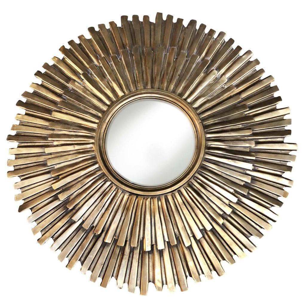 A round, vintage Mid-Century modern French decorative gilded sun wall mirror with a patinated gold finish and original glass, in good condition. Wear consistent with age and use. Circa 1950 - 1960, France.
