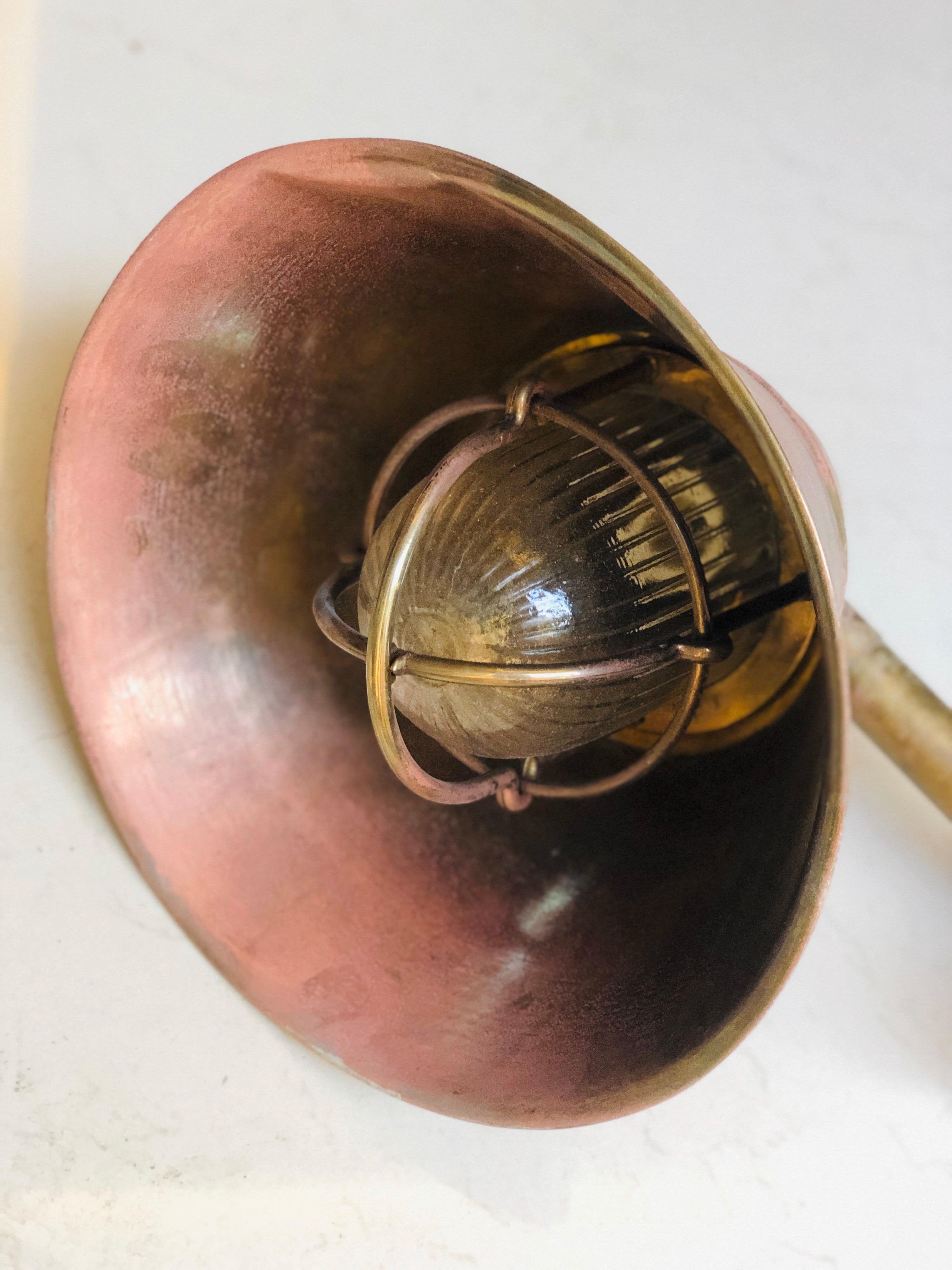 Authentic round marine lamp in very good condition made of copper and brass. Two pieces available, France, circa 1920.