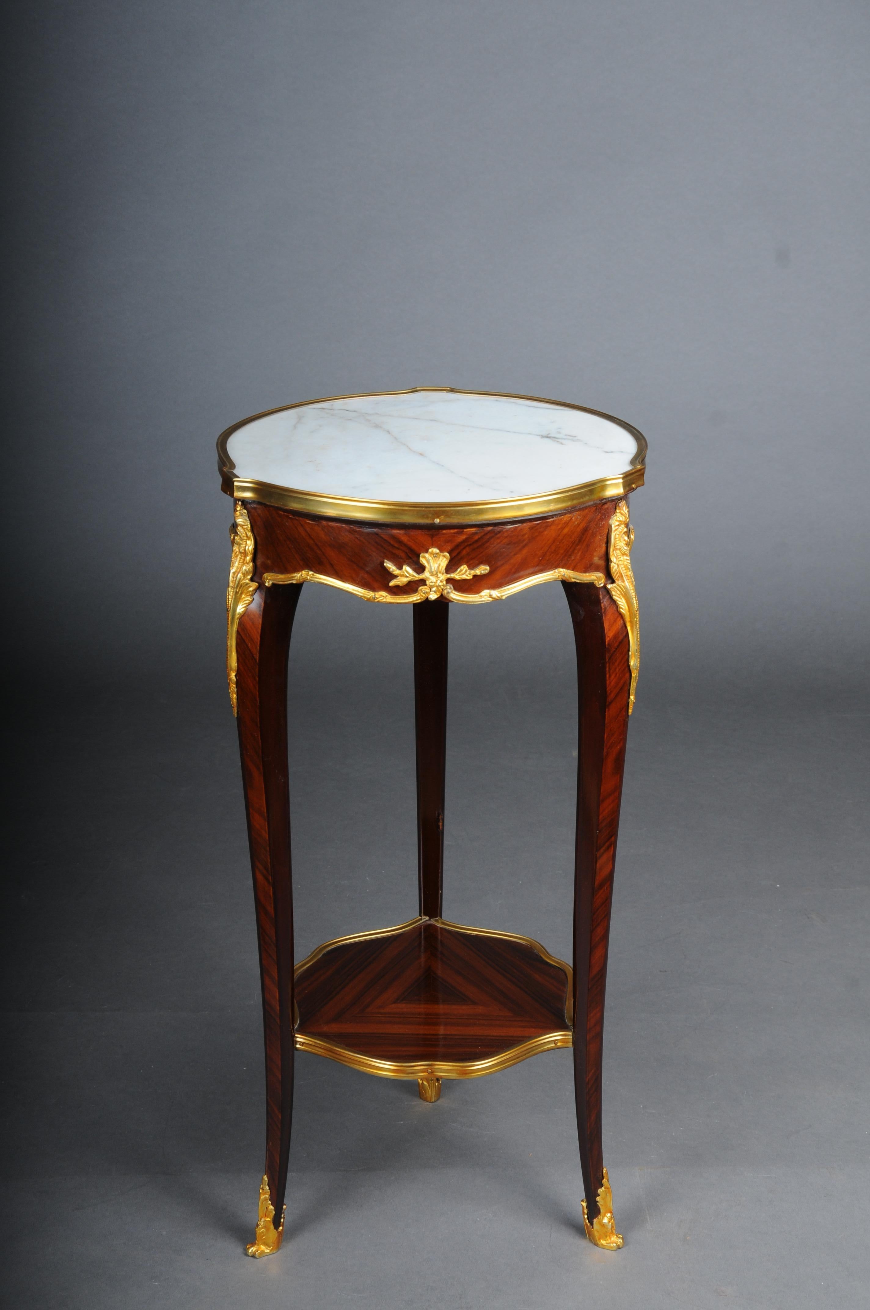 20th Century French Salon Side Table in Louis XV after F. Linke, Beech

Solid wood side table in Louis XV. Slightly convex and concave, carcass, flanked by solid corner glaciers on high, elegantly curved legs, connected below by a curly brass frame