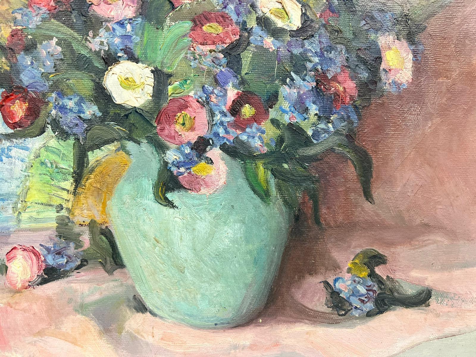 teal vase with flowers