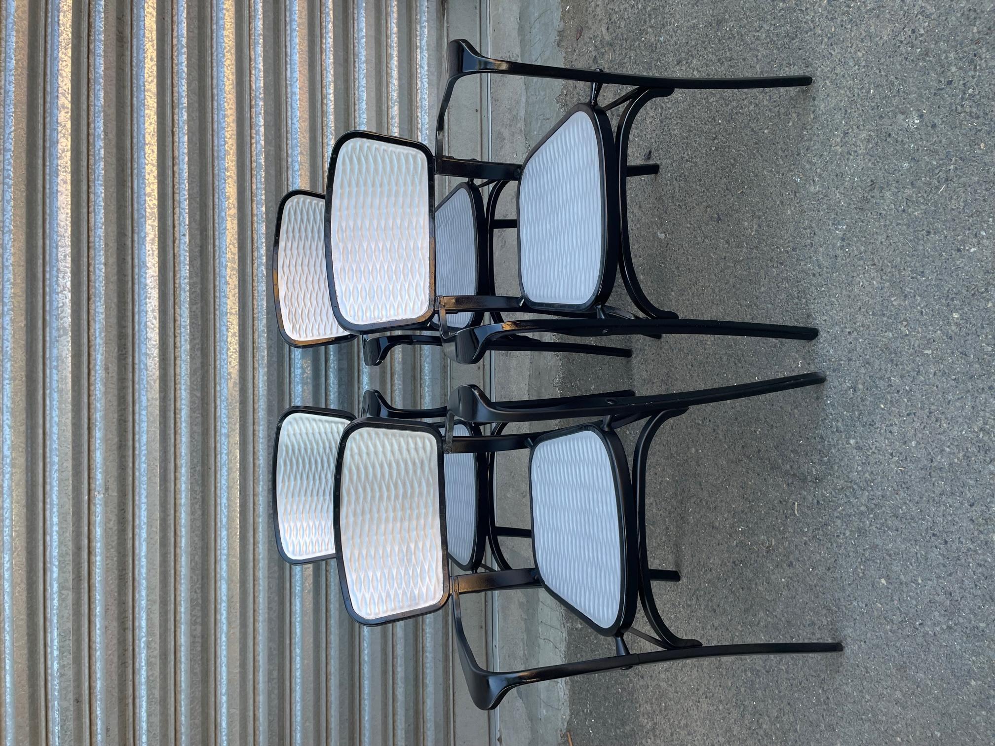 Very nice set of four painted aluminum chairs stamped at the back by Gaston Viort in the 1950s for the 