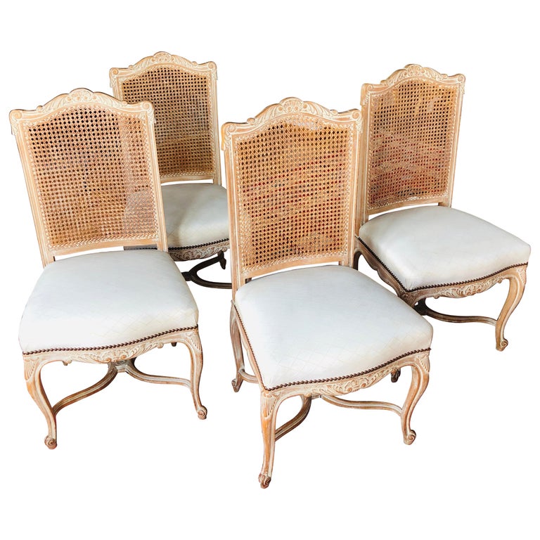 20th Century French Set of Four Hand Carved Dining Chairs with Tall Cane Backs For Sale
