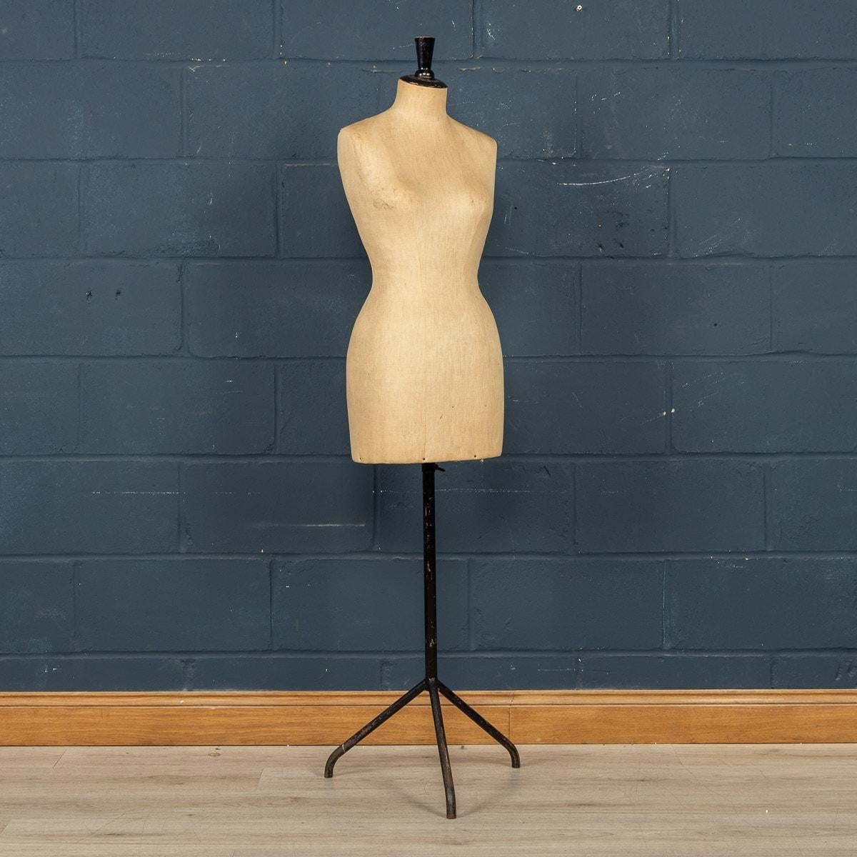 A lovely shop display mannequin dating to the early part of the last century. This quality vintage French mannequin or Taylor's dummy dates from around the 1910s era and has a black steel base. The neck retains its original finial and the fabric is