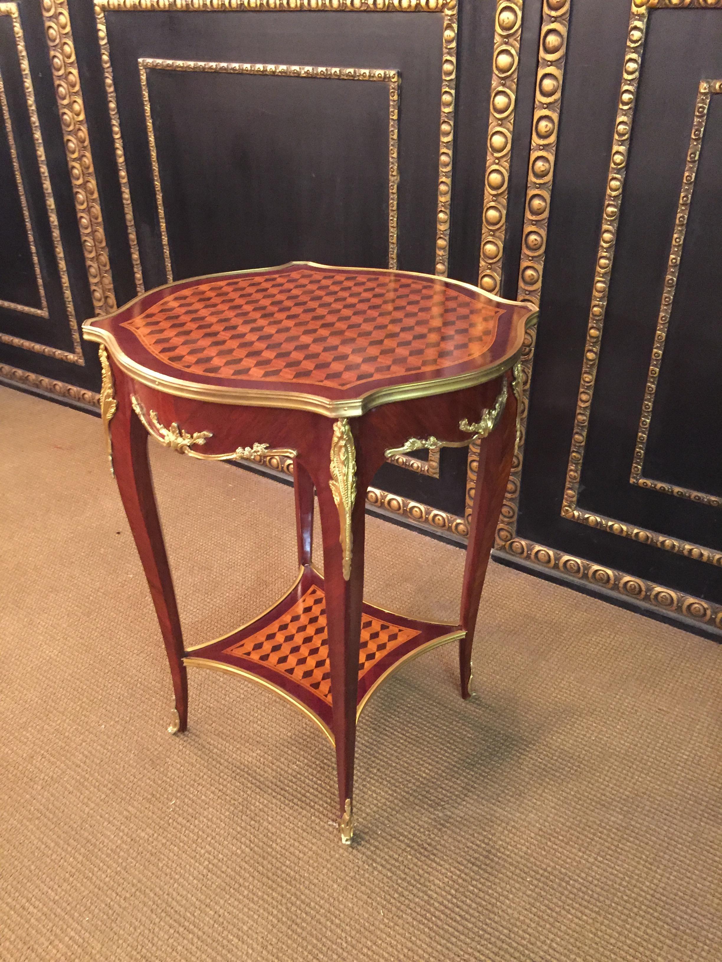 Rosewood on solid beech with inlays, slightly convex and concave, carcass, flanked by extended corner strips on high, elegantly curved legs in ending with lower sabots.