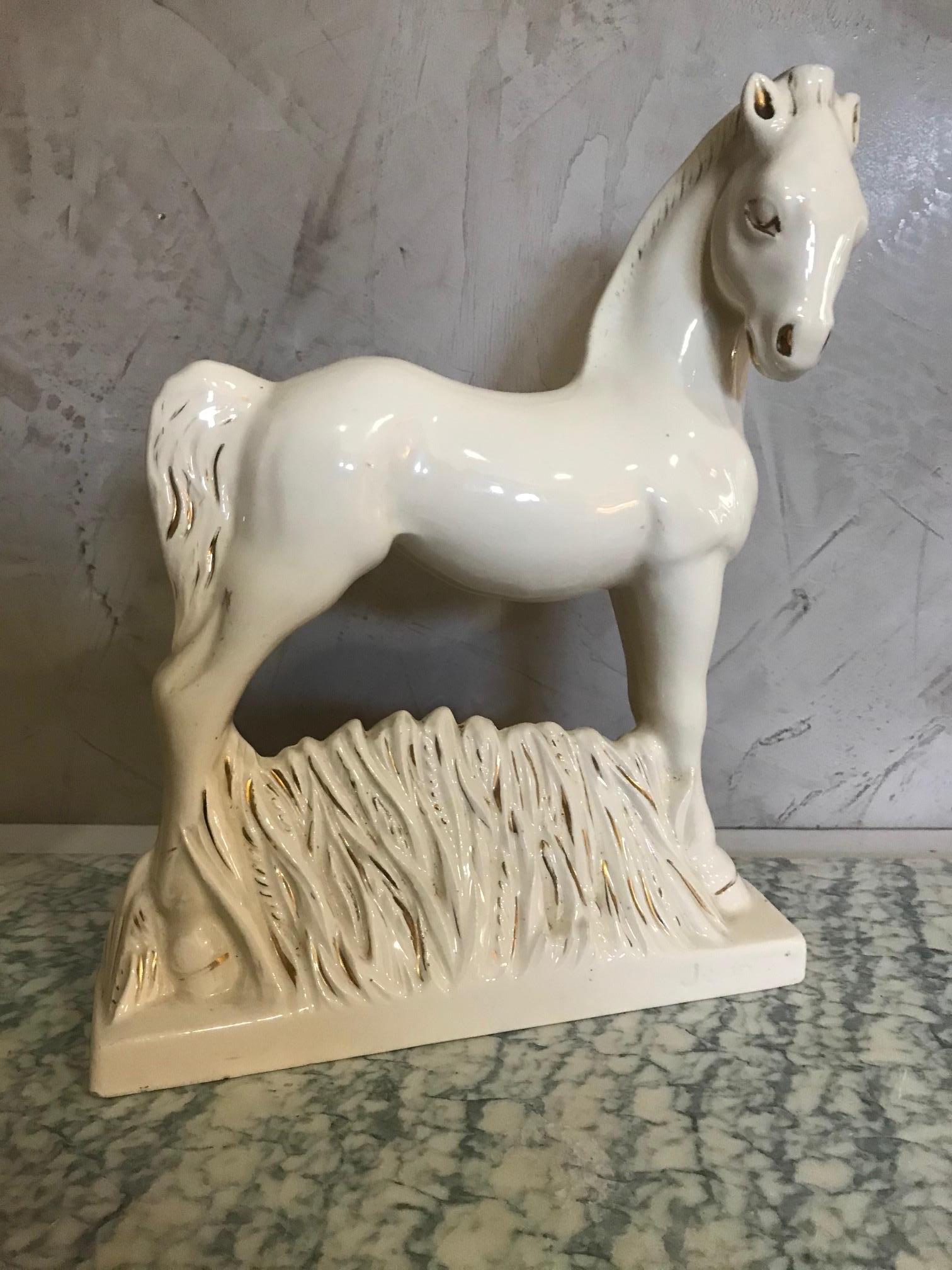 Very nice 20th century French signed earthenware horse from the 1950s. 
White and gold. 
Signed by Jean on the base. Made in France.
Good condition and quality.