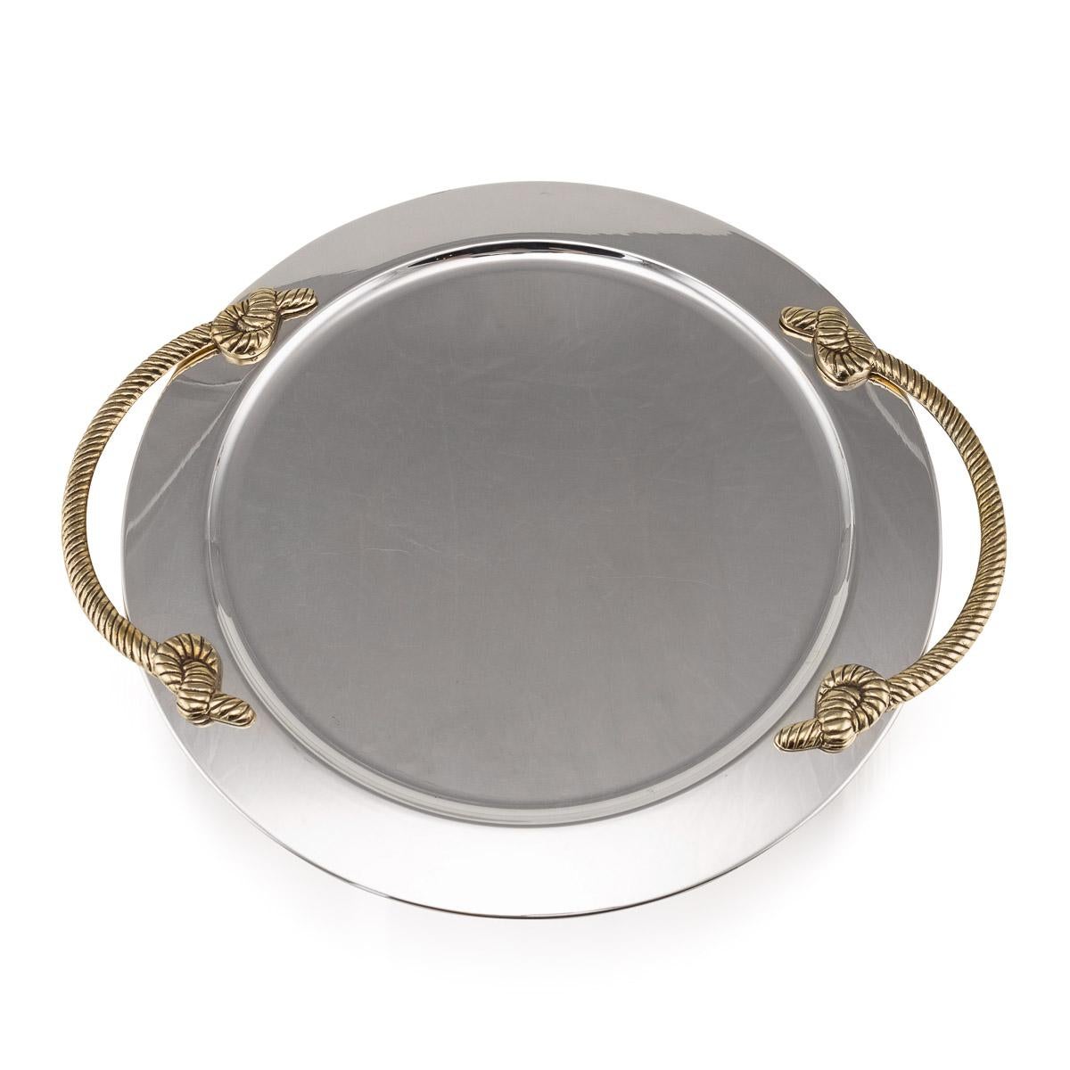 Mid 20th Century large French circular silver plated serving tray with polished brass rope handles.

Condition
In Great condition - No damage, just general wear.

Size
Diameter: 46cm
Width: 53cm handle to handle
Height: 3cm.