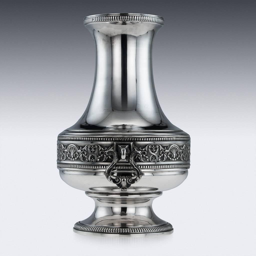 Antique 20th century French solid silver large vase, the body applied with a decorative band and gadrooned boarders, each side applied with a shell and leaf swinging handle. Hallmarked French silver (950 standard), Paris, Maker Societe Parisienne