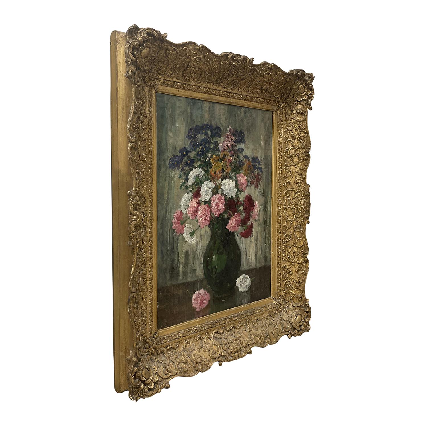 A light-green, grey vintage Art Deco French still life oil on cardboard painting depicting a working table with a green vase with flowers, painted by Camille Matisse in a hand crafted, original gilded Pinewood frame, in good condition. The colorful
