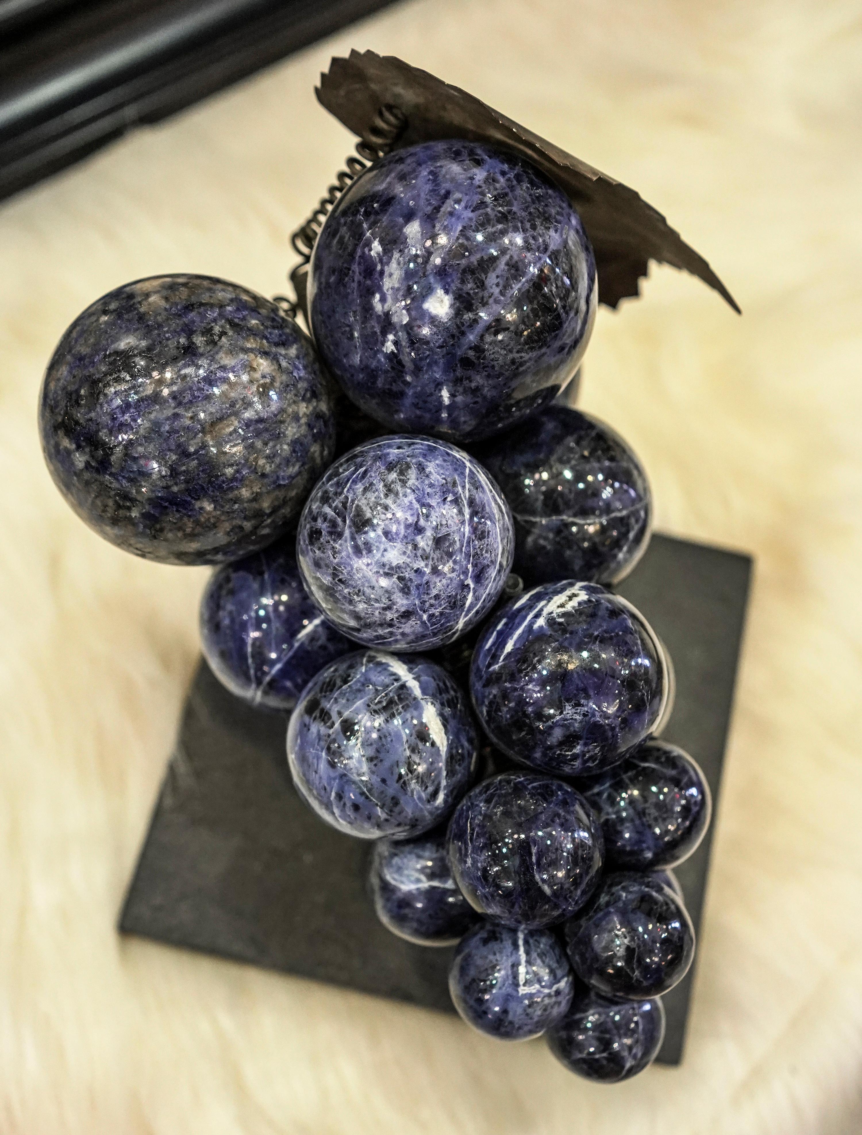 Gorgeous French sculpture of grapes in semiprecious blue Lapislazuli in large carved balls and
stem and leaf in golden brass,
A very special work of art as chic as unique!!!