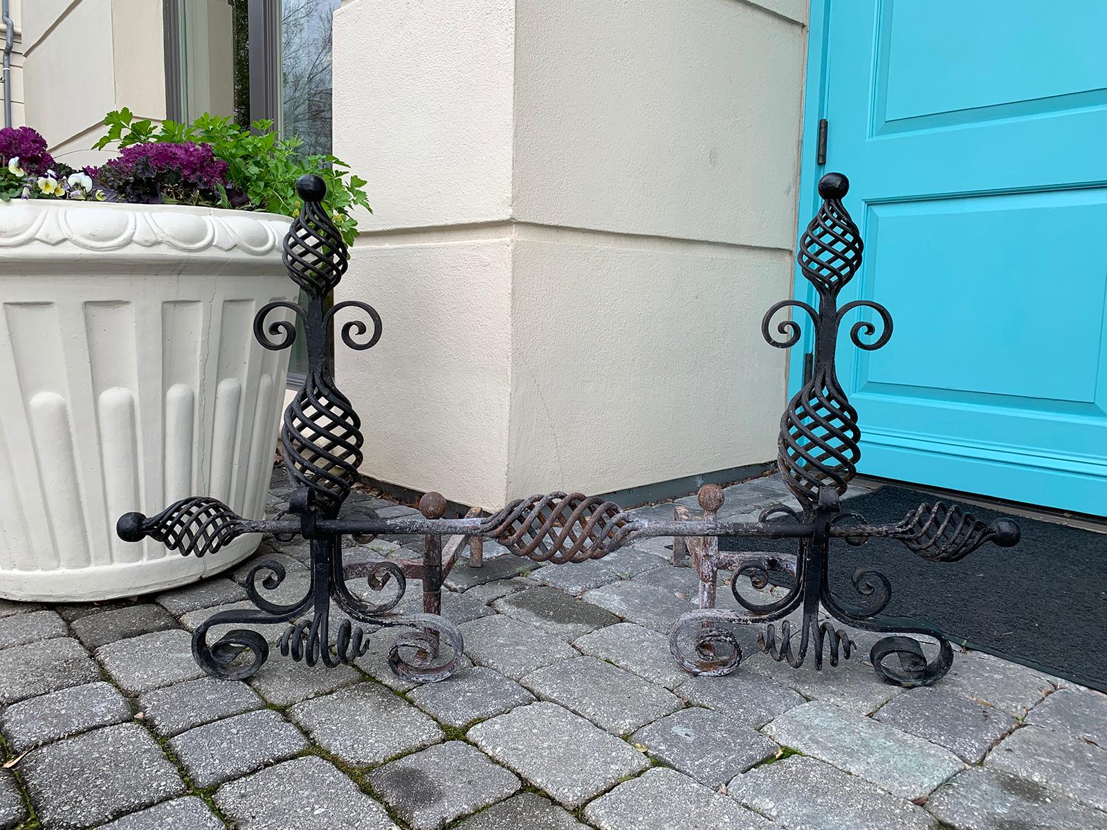 20th century French style handwrought iron andirons with log roll bar
Measures: 15.25