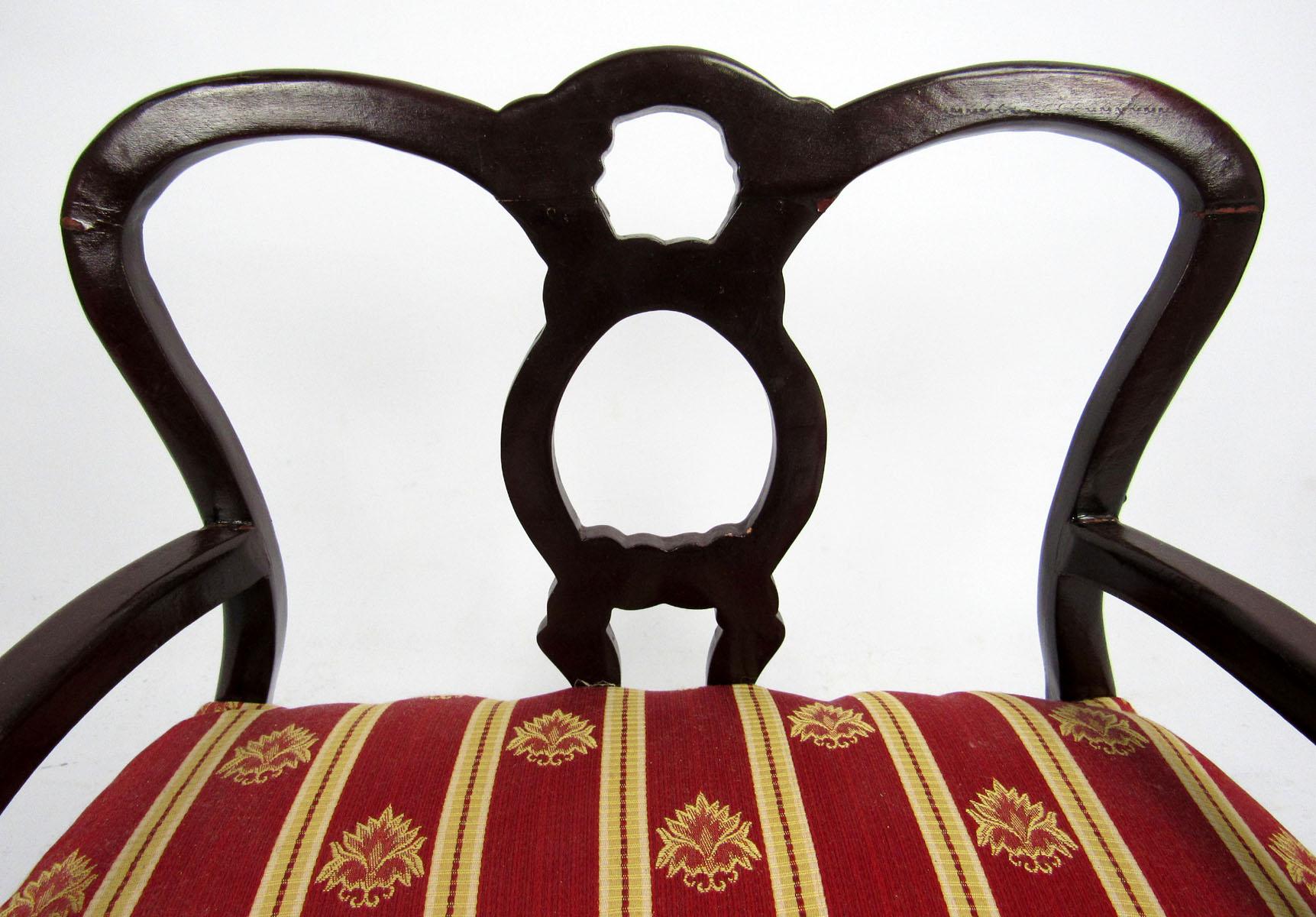 20th century French style miniature settee upholstered in red and gold striped fabric.