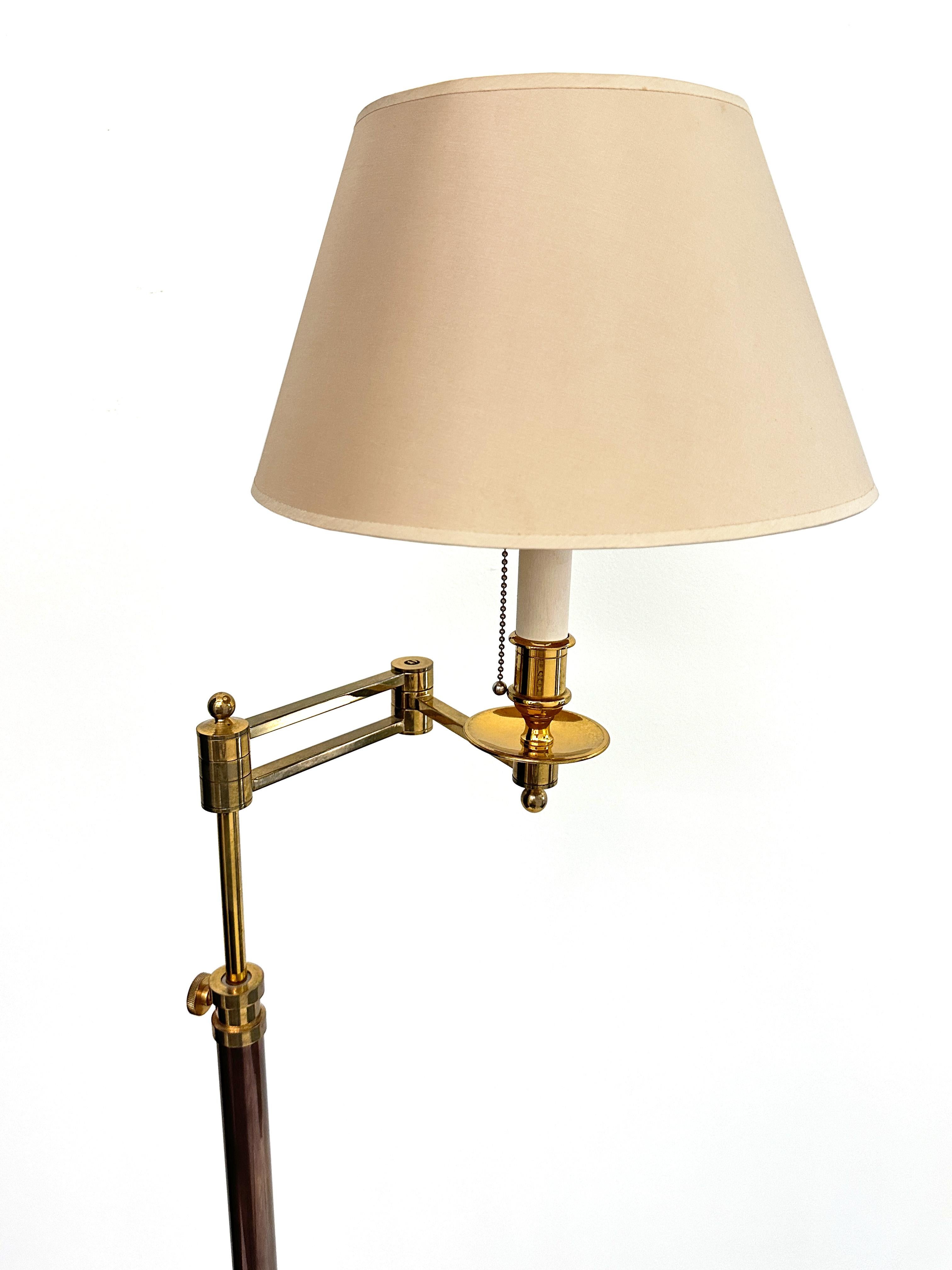 French 1900s contemporary swing arm adjustable height floor lamp. Made of brass and bronze with a beautiful pale pink lamp shade. Lamp US Standard wall plug in working conditions. 

Min height with lamp shade 60