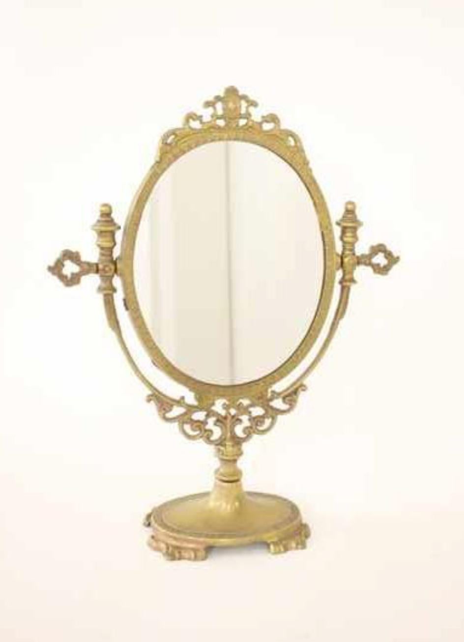 20th century gilded bronze table mirror decorated with palmettes, a graphs, sheets of water and foliage.
France, circa 1920.
   