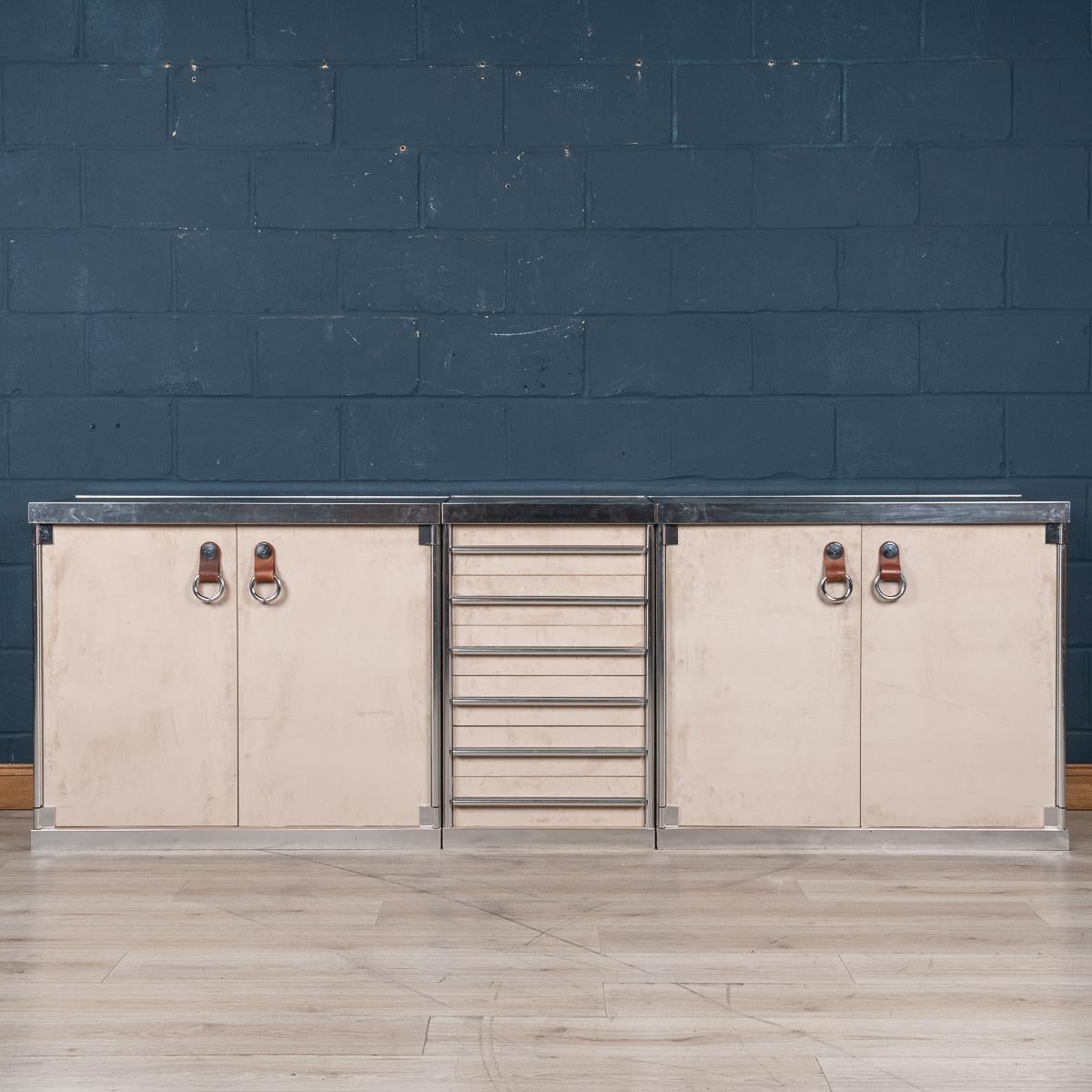 A superb three-piece sideboard consisting of two cabinets and one bank of drawers designed by Guido Faleschini for Hermes, France, circa 1970. Hermes barely needs any introduction: it is probably the most famous firm in the world known principally