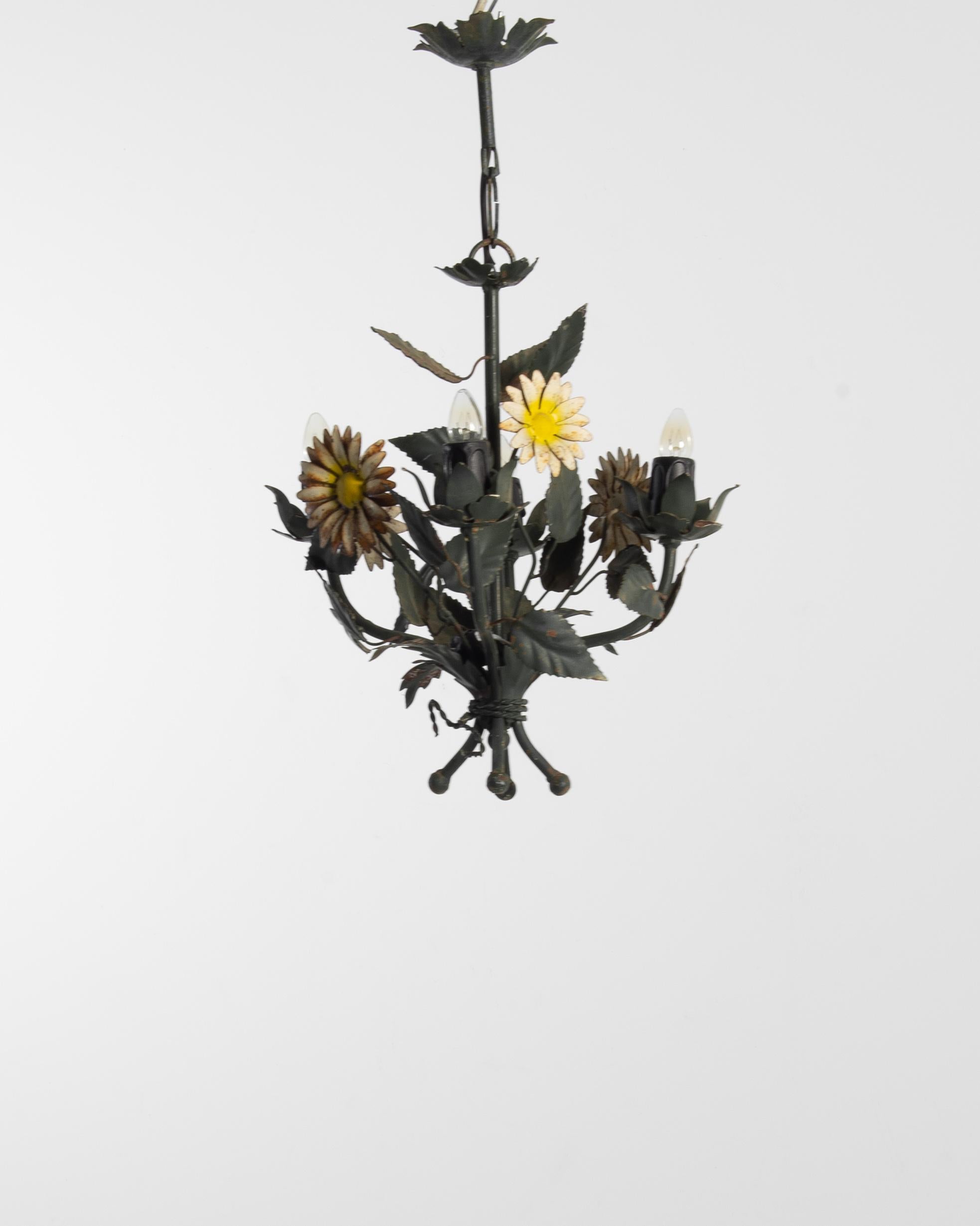 Made in France in the 20th Century, this beautiful metal chandelier imitates the form of a bouquet of wildflowers. Ox-eye daisies blossom among green leaves; a woven cord wraps round the stems at the base. The detailed forms and asymmetric