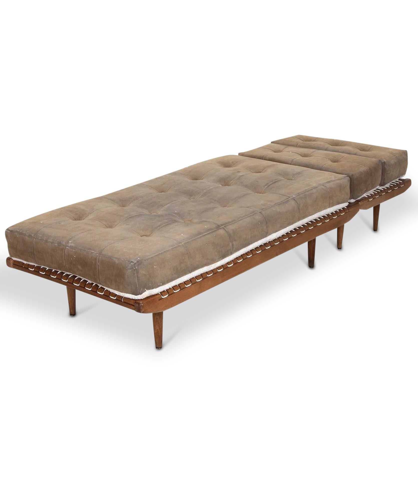 A very stylish reversible 20th Century French chaise longue.

By the famous designer Georges Tigien, Circa 1950.

With wonderful nap suede leather in olive green. With buttons to one side and faux fur to reverse. Main seating area with a separate