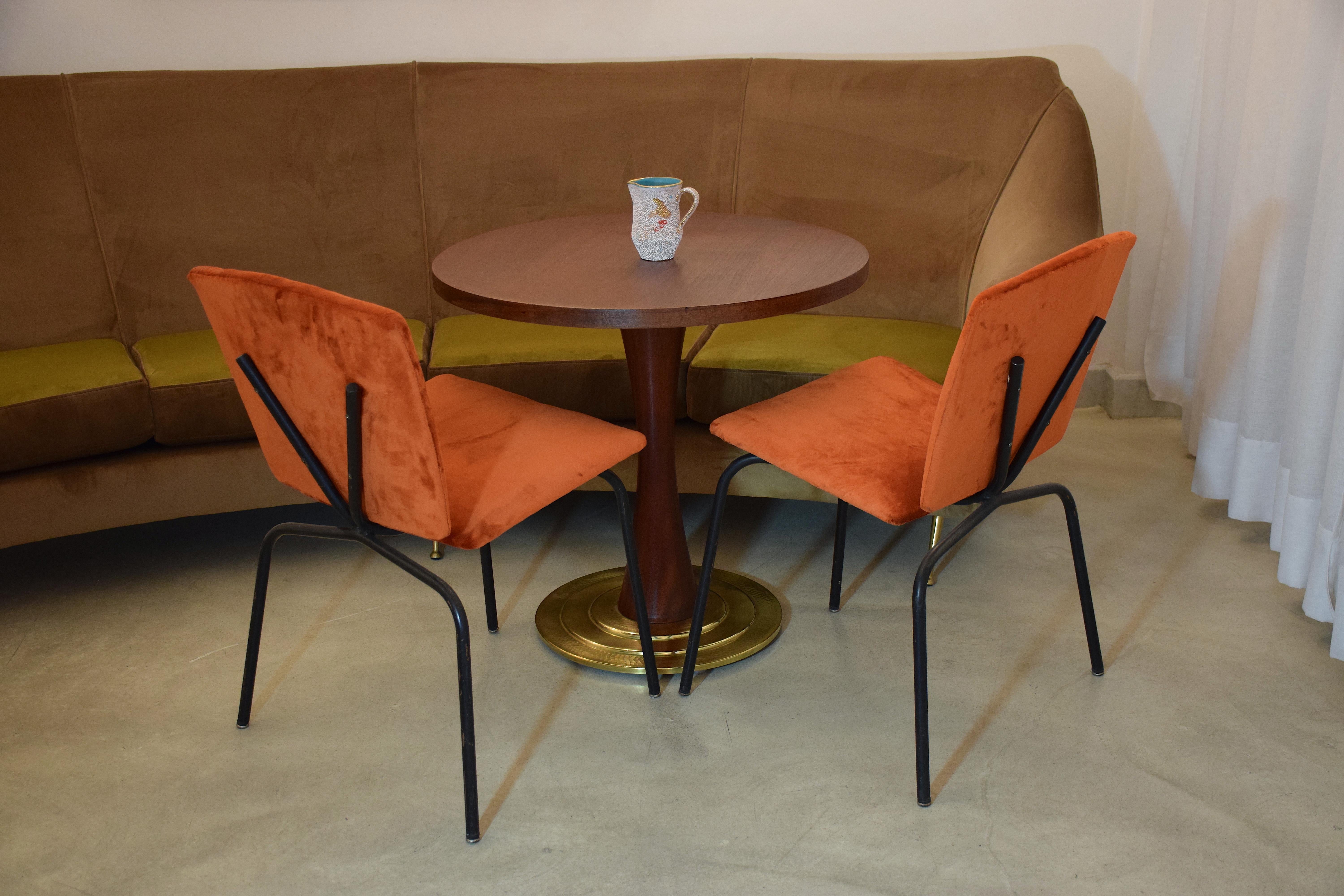 Pair of French 20th century vintage chairs composed of a tubular black lacquered steel structure with an original v shaped back. The chairs have been re upholstered with a Lelièvre Paris vibrant orange velvet, one of the highest quality French