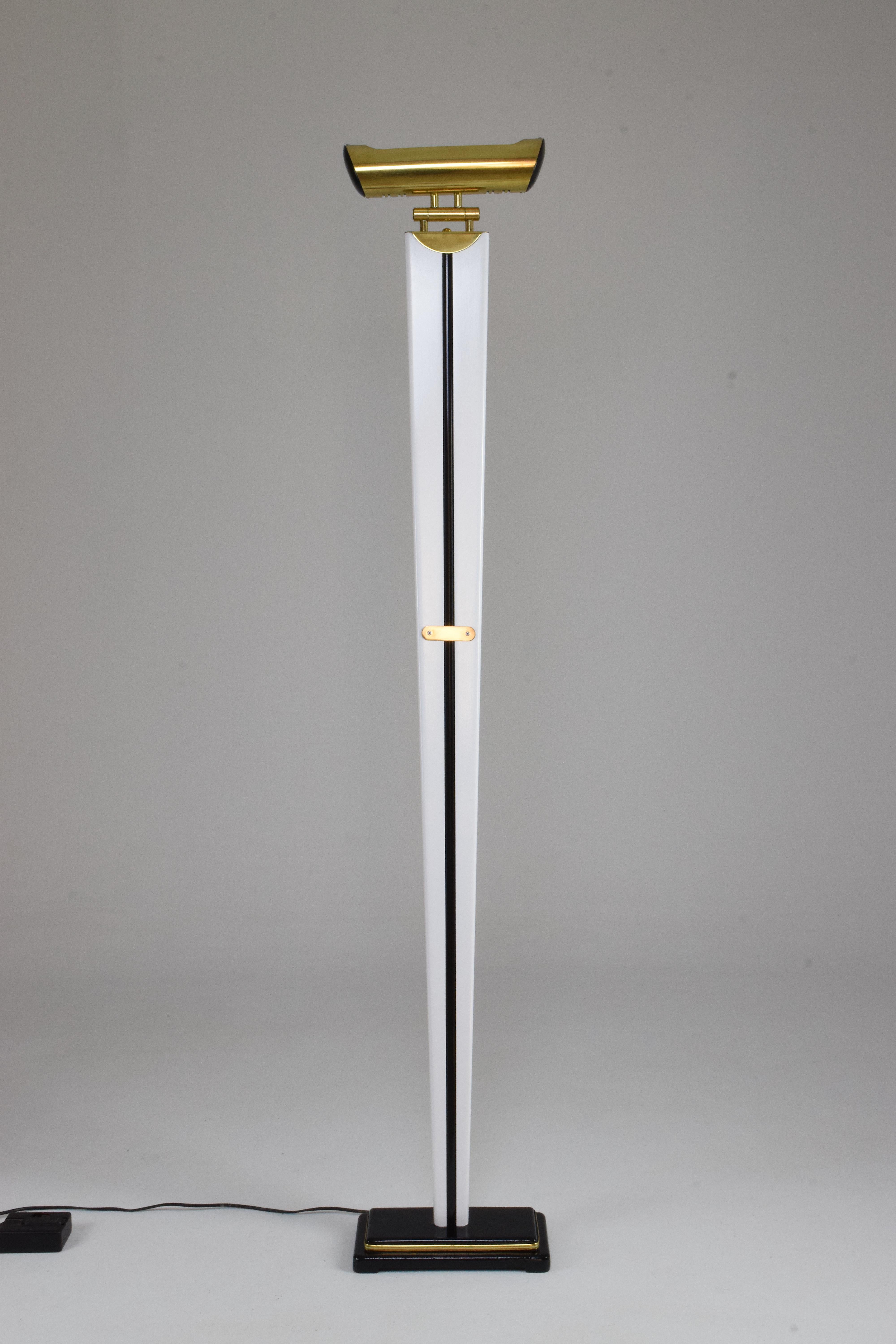A stunning French vintage floor lamp from the 1970s in Art Deco style designed out of wood, brass and steel. In fully restored, re-lacquered condition. The shade articulates at the base. The wiring is with the original dimmer switch and has been