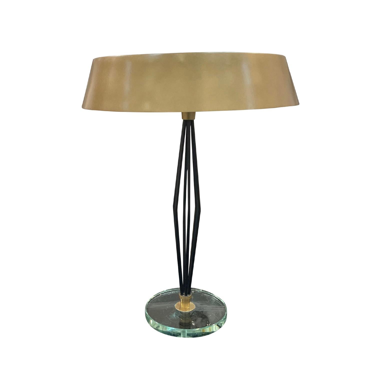A vintage Mid-Century modern French, Italian table lamp made of hand crafted lacquered metal designed by Max Ingrand and produced by Fontana Arte, in good condition. The sculptural desk light with a three light socket has a round painted bronze