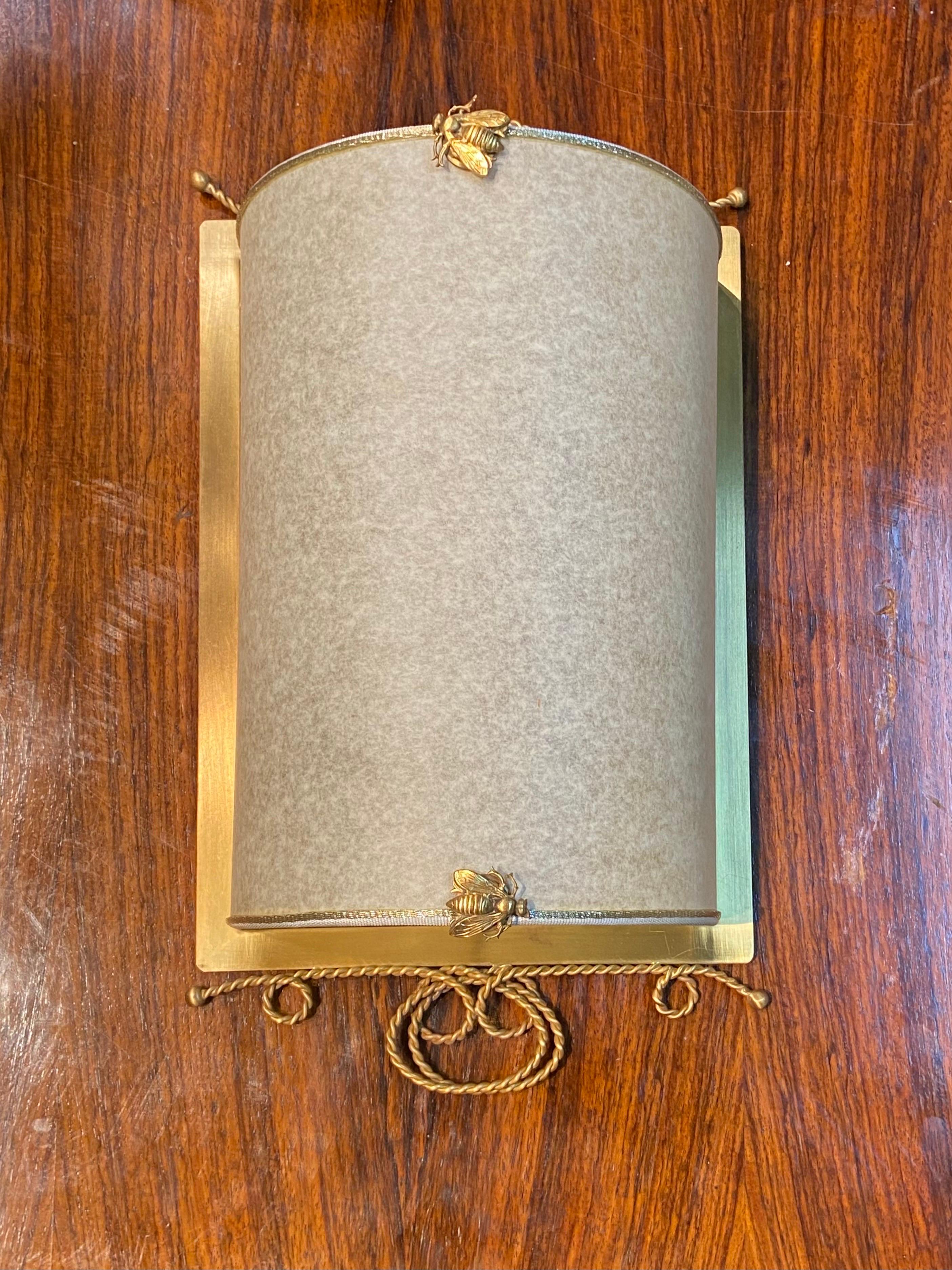 Midcentury French wall sconces made in brass and special paper and elegantly decorated with small brass bees. Price is for piece.
France, circa 1950.