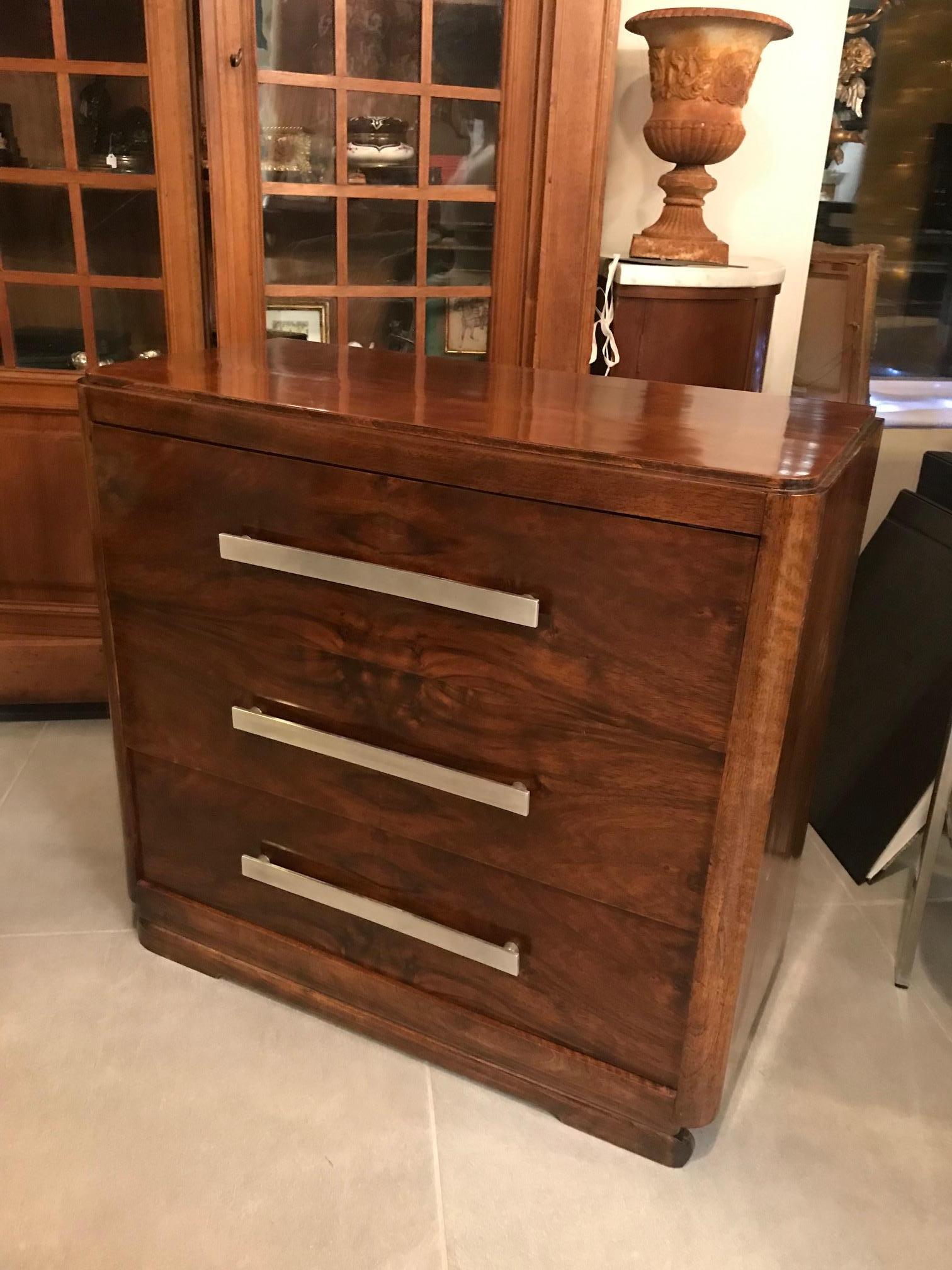 Beautiful 20th century French walnut and chromed metal commode from the 1940s. 
Has been restored by a cabinetmaker. This commode is very interesting because the size is ideal. Can be used as a bedside or in a living room. Three large drawers with