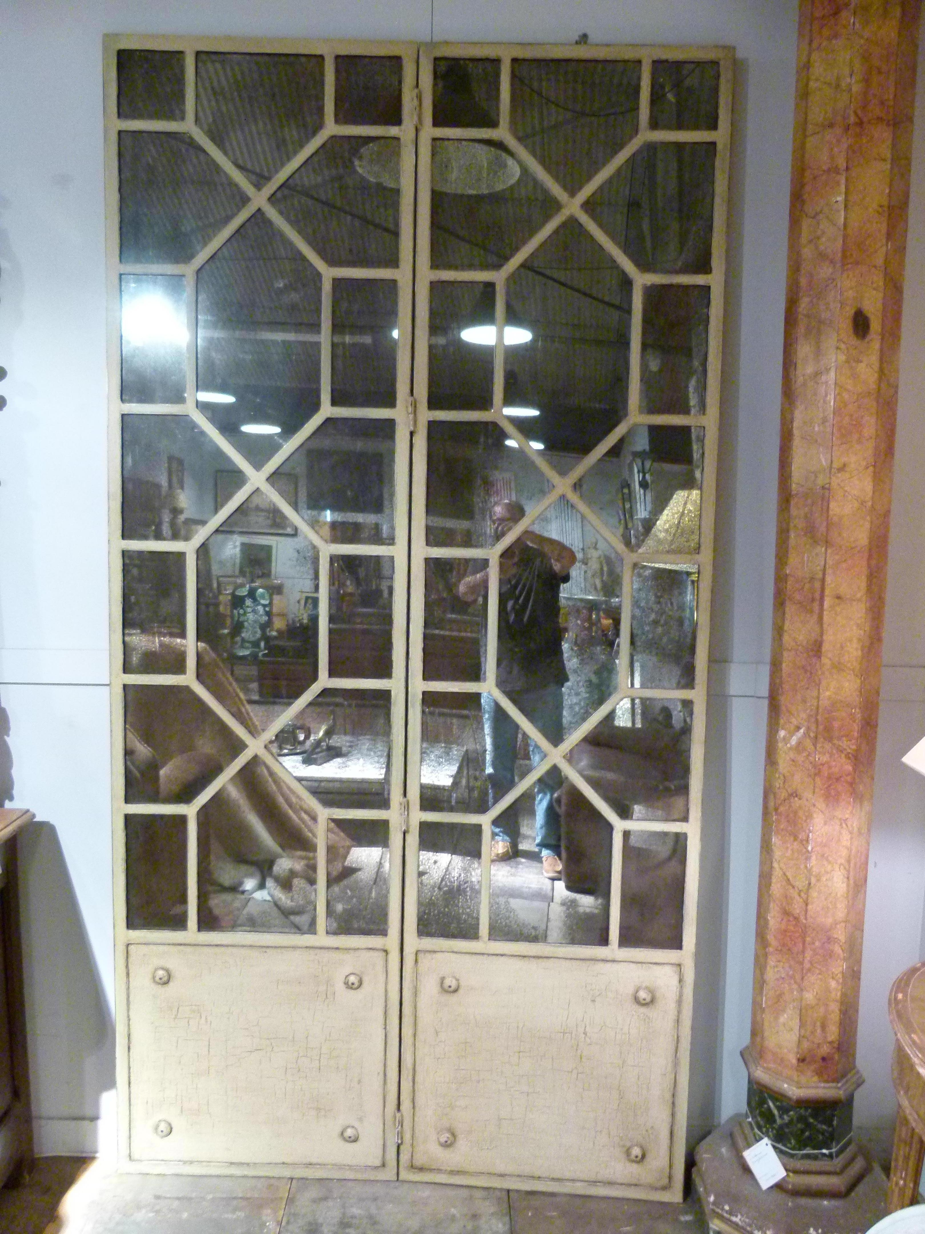 20th century french white painted iron double door with mirrors. The door is formed by 4 elements: 2 x 2 double doors (fourfold).
Each set of doors measure 130cm ( 51 in), so double door 260 cm (102 in)

A unique decorative interior door that