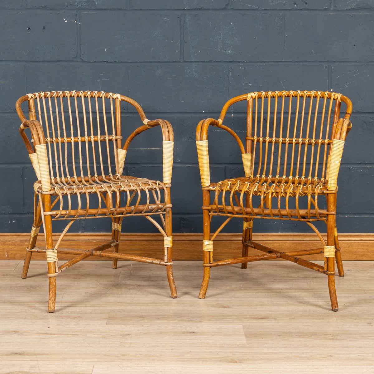A charming pair of mid century wicker chairs made in France in the 1960s by Maison Drucker. Sometimes referred to as “bistrot chairs” as the model is so commonly seen in French bistrots up and down the country, what sets these apart from their
