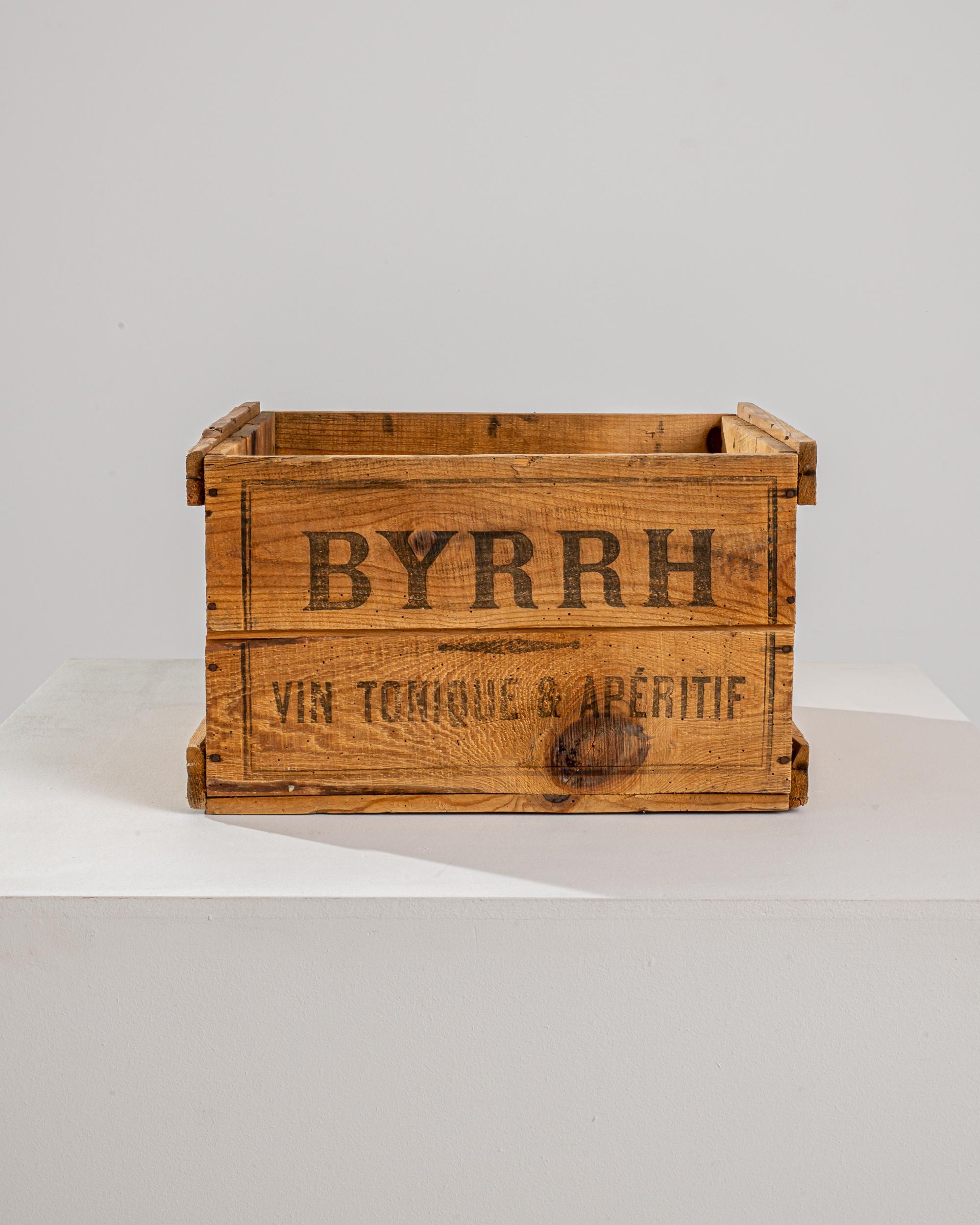 A 20th century wooden box produced in France, originally made to preserve and carefully transport Byrrh bottles, a traditional french apéritif made of red wine, mistelle, and quinine created in 1866 in Thuir, Pyrénées-Orientales. Made of a sturdy