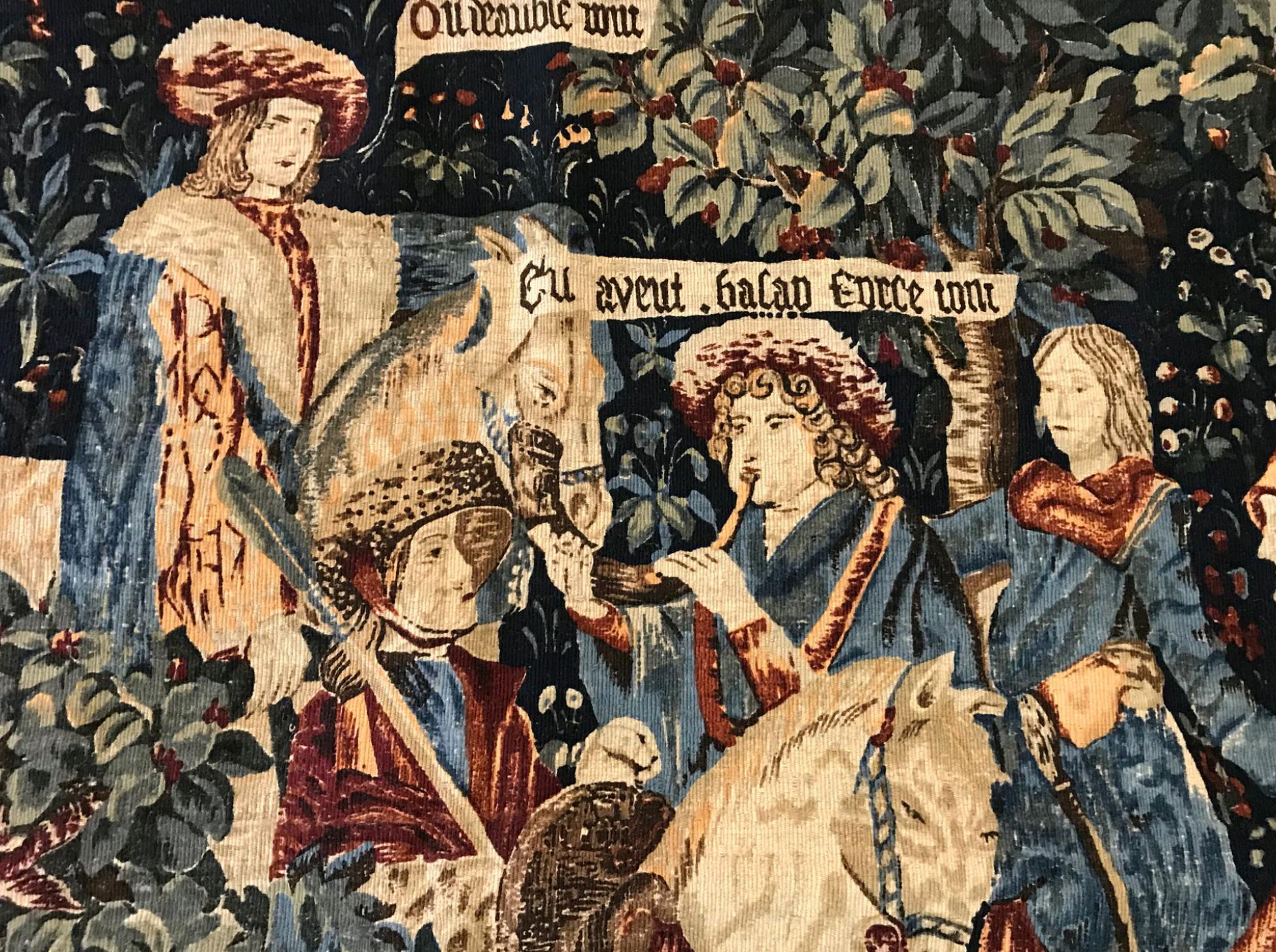 French wool tapestry representing a medieval scene with characters and animals on a background of plants, 
circa 1930
Measures: 125 x 196 cm.
 