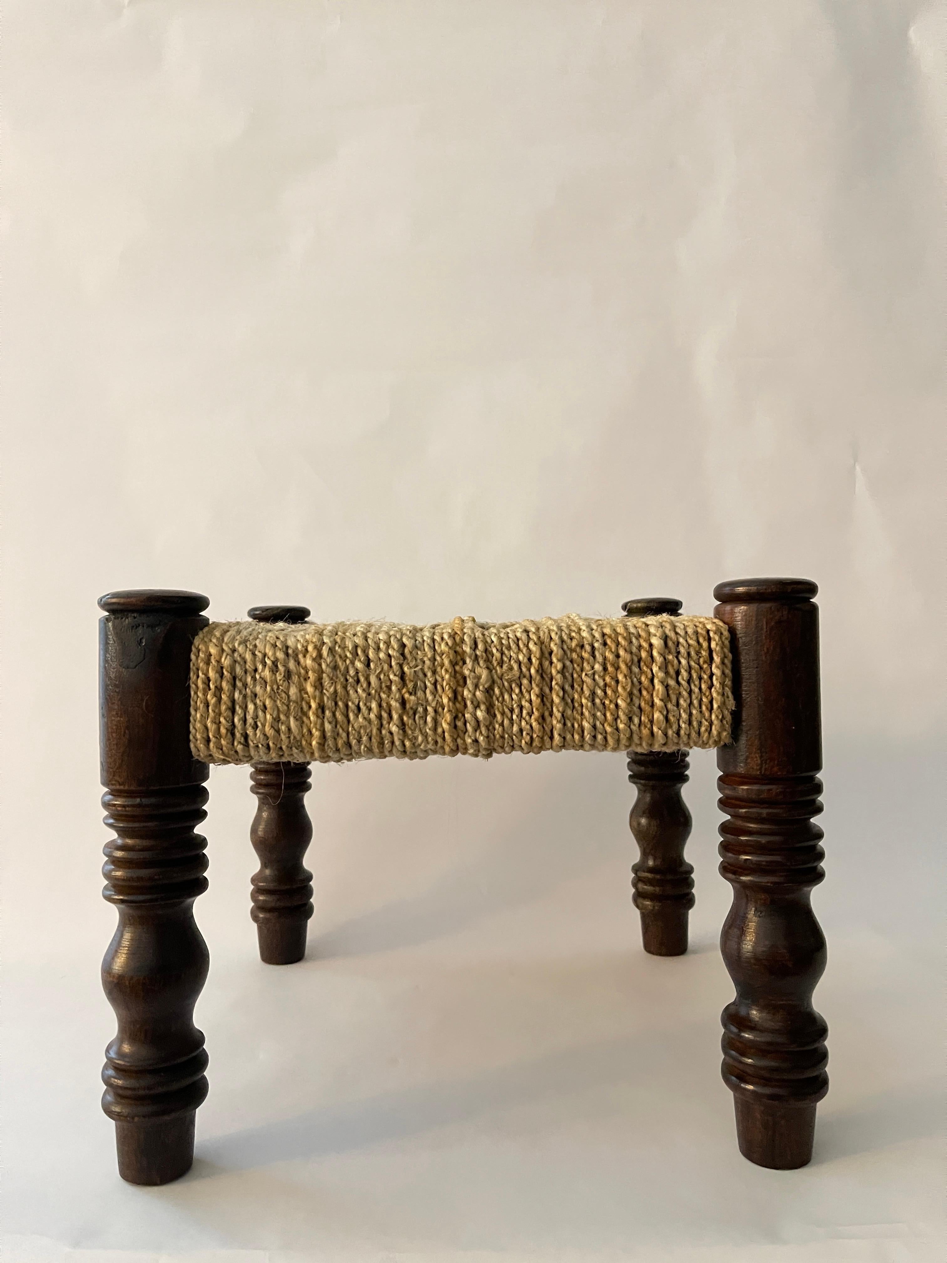 20th Century French Woven Mini Stool on beautiful dark wood legs. Unique woven pattern and marvelous hand crafted legs. Perfect statement piece for any room!