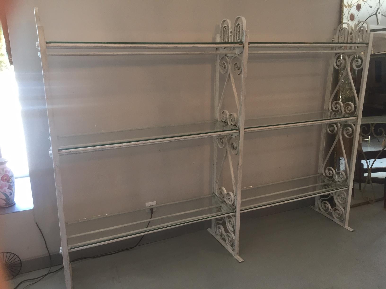 Beautiful 20th century French wrought iron florist shelf from the 1920s.
Every glasses ont the shelves are custom made and removable. 
The iron is white and has been weathered with time. 
Very nice quality.