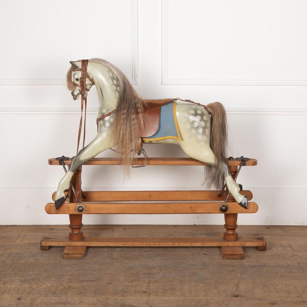 Early 20th Century Lines Brothers tri-ang dapple grey rocking horse is a classic children’s toy from the early 1900s. Lines Brothers was a British toy manufacturer that produced a range of toys, including rocking horses, under the triang brand. This