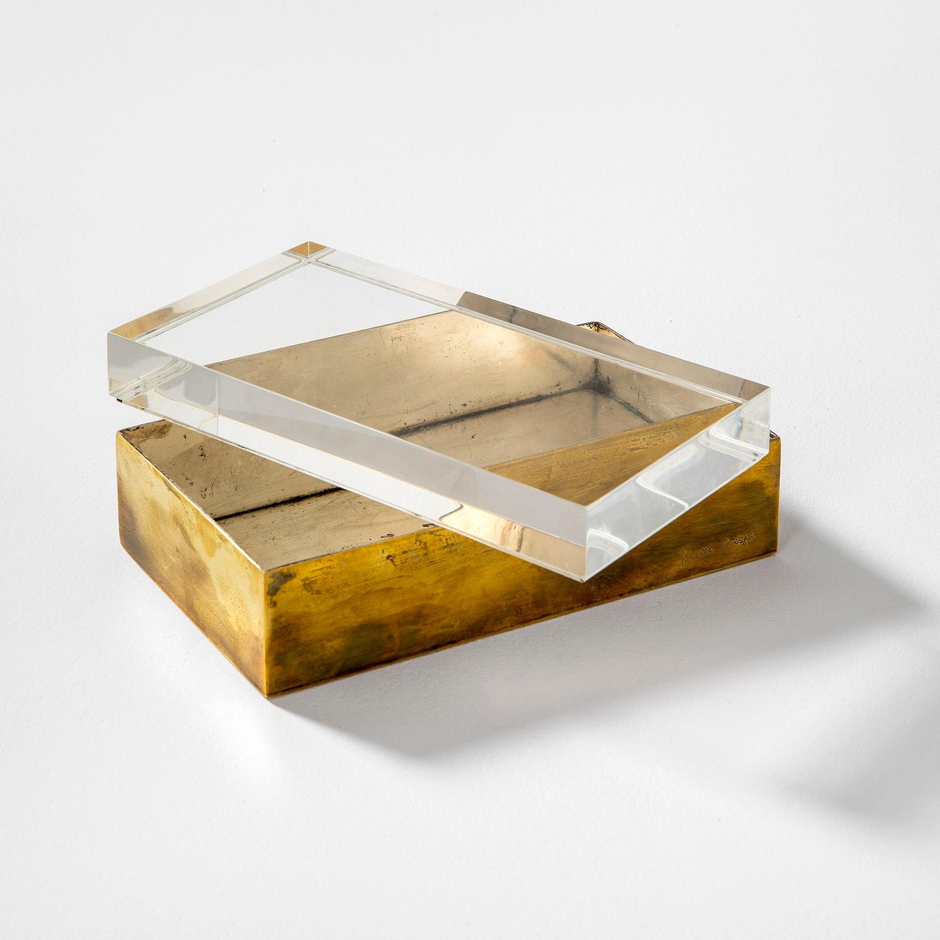 Decorative box designed in '70 by Gabriella Crespi. The box is in plexiglass and brass, on the brass is present the signature of the author.
Good condition, patina of time. Perfect also for jewelry, for the desk, or for collecting litlle objects.