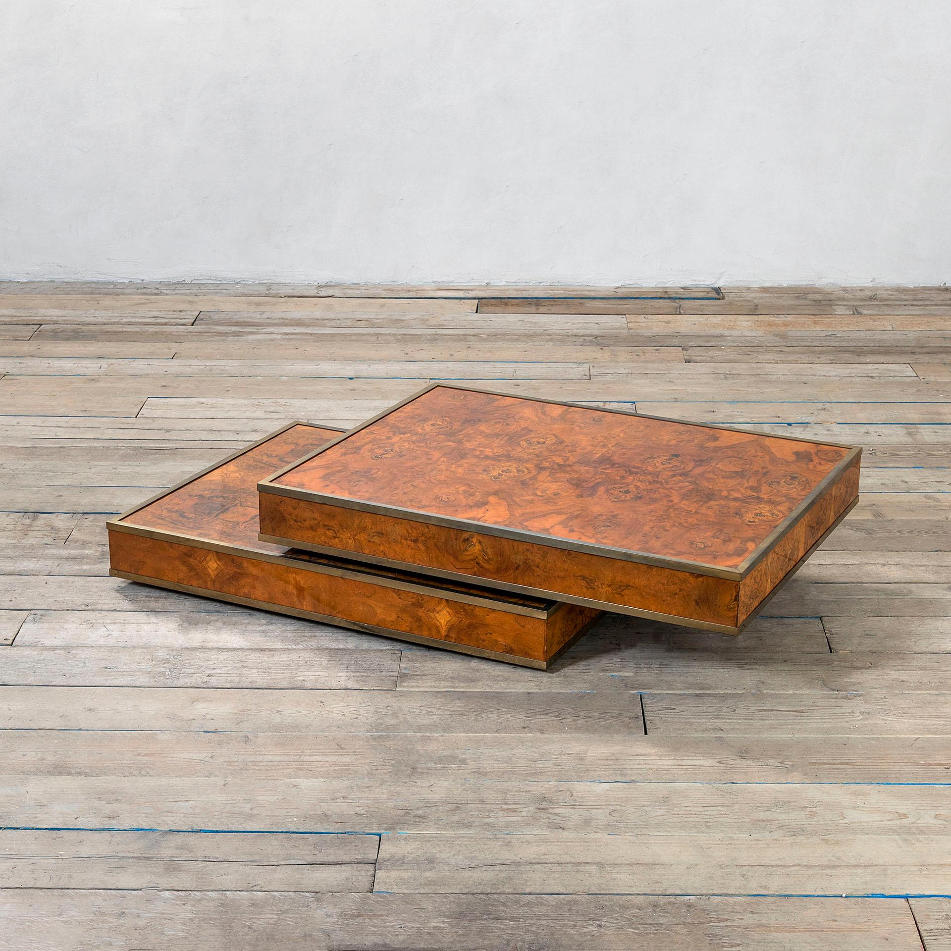Coffee or centre table. The table was produced in '80s, it has a wooden structure, covered by walnut burl and with corners covered by brass. Thet table could slide and trasnform into a double top table. 
The dimensions as closed are:
34 x 120 x 91