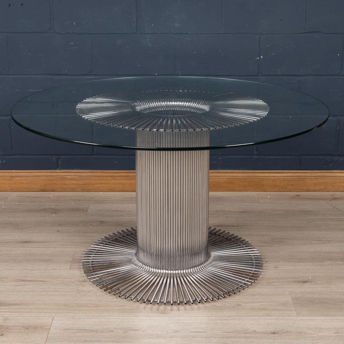 An elegant dining table designed by Gastone Rinaldi for RIMA, Italy, circa 1970. Known for blending industrial design with art, the tubular structure of the table is emblematic of Rinaldi’s work. Dozens of chromed tubes scrunched together to form a