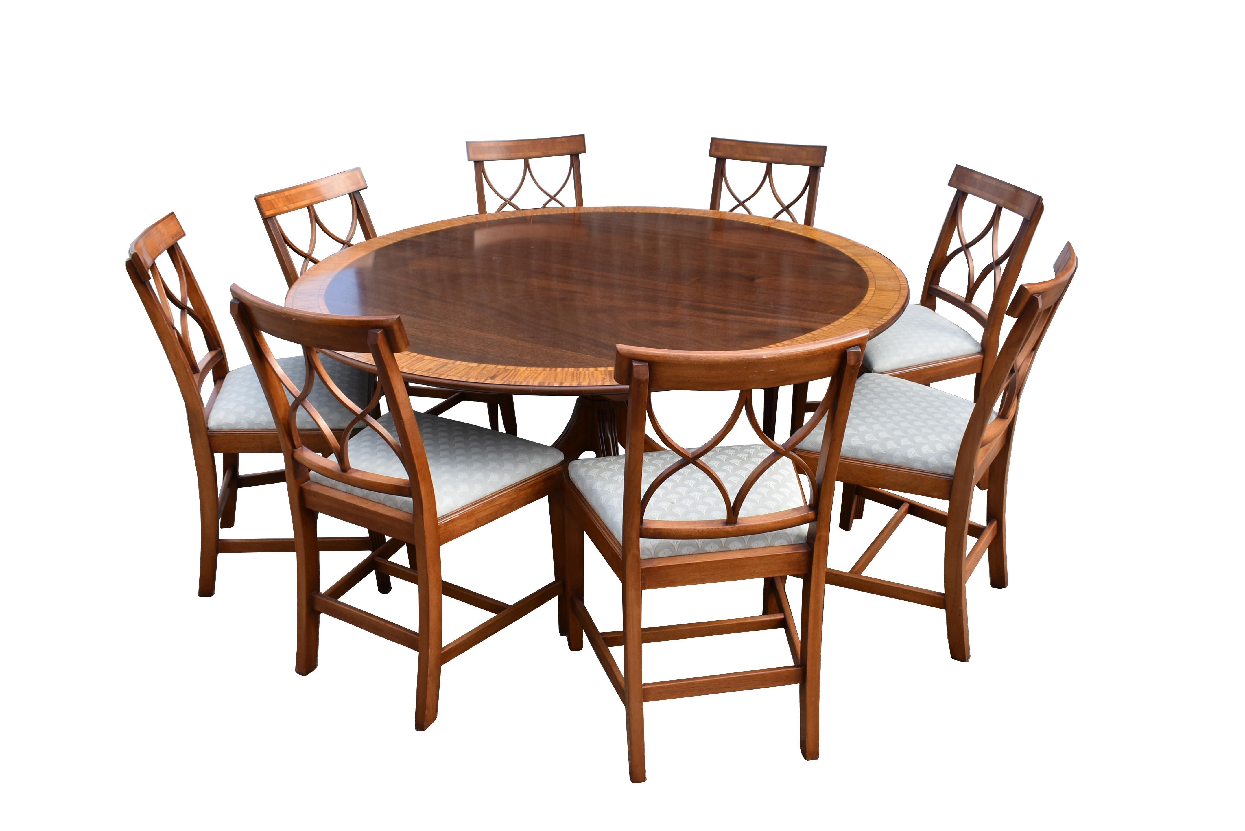 For sale is a very good quality circular dining table made in the Georgian taste by William Tillman. The round top has a banded edge with nicely figured mahogany to the centre, standing on a pedestal base, terminating on four splayed legs and