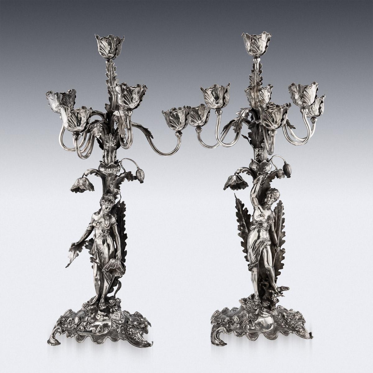 20th Century German Art Nouveau silver monumental seven-light candelabra, beautifully modelled, on shaped and beautifully decorated bases, applied with whiplash leaves, the two amazonian female figures, one holding a flower and the other a fish and