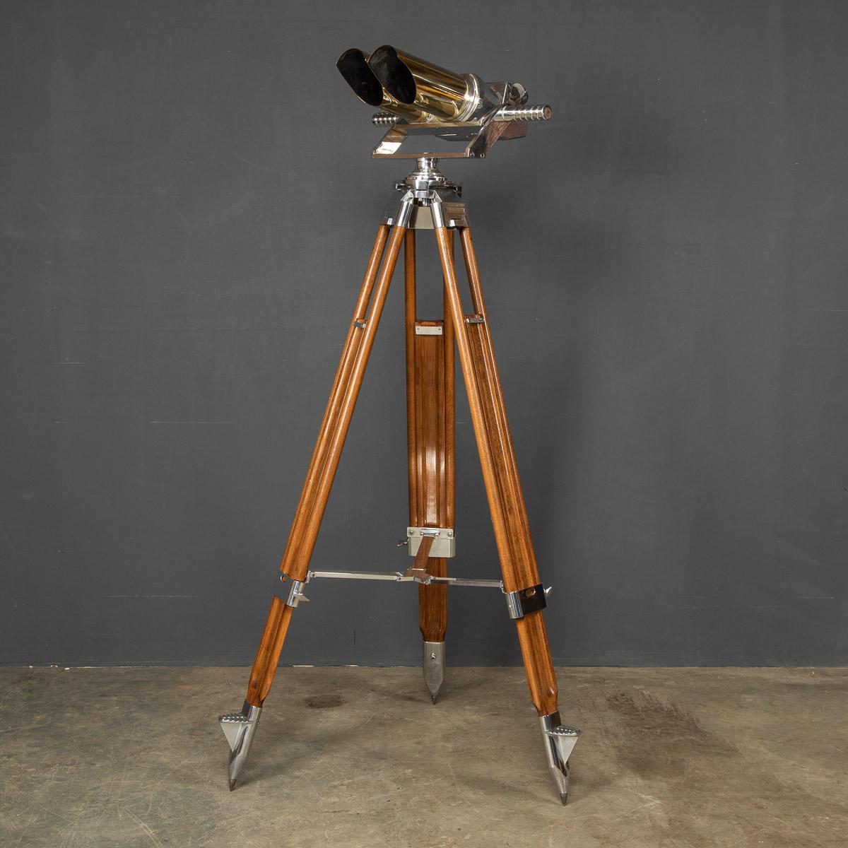 Exceptional 20th Century German polished steel observation telescope binoculars on a later telescopic stand by Joseph Schneider. This model was originally designed by Emil Busch and it has been adopted by the military in 1936.

CONDITION
In Great