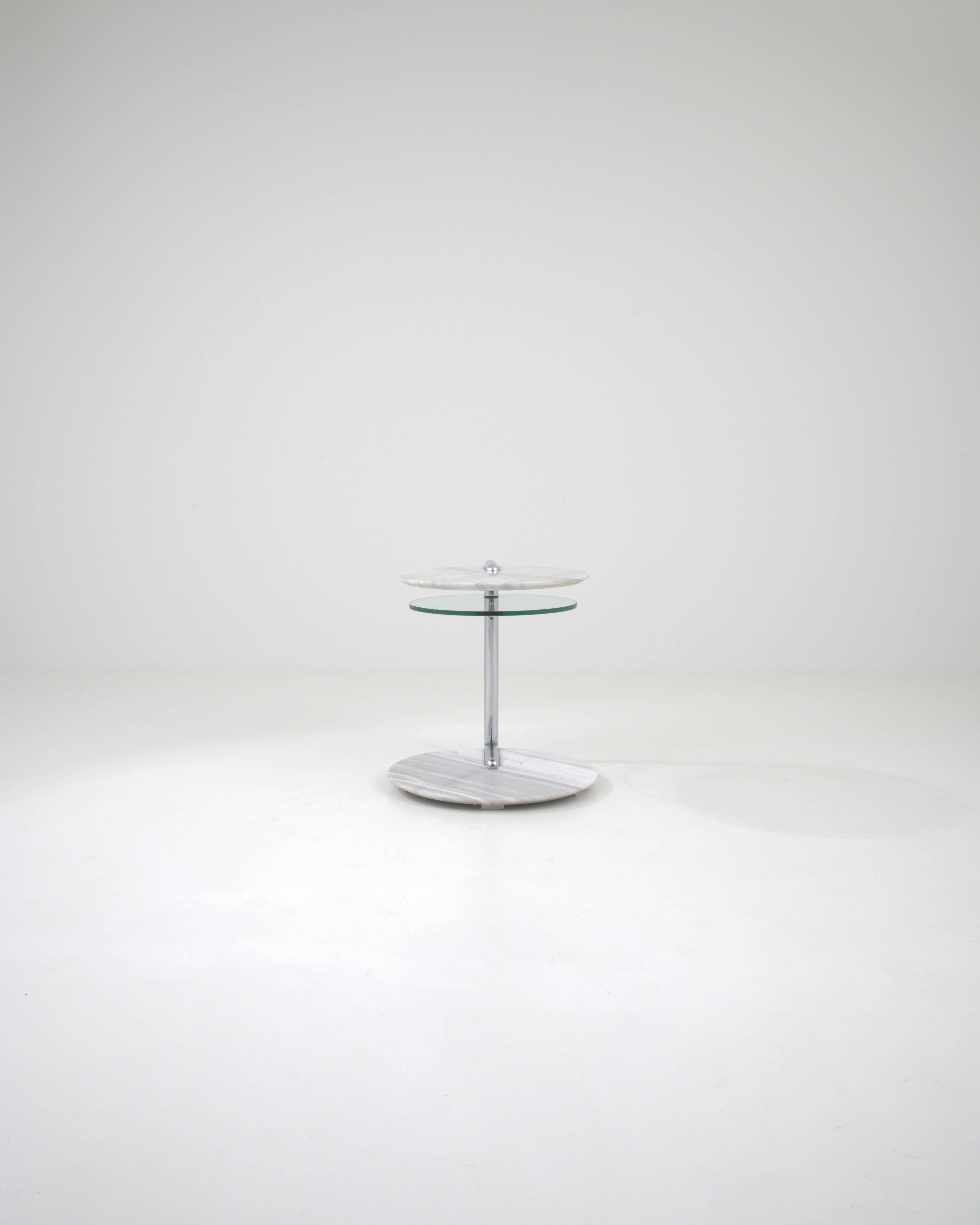 Elevate your living room with the Rolf Benz Marble & Glass Coffee Table, an exemplar of 20th-century German craftsmanship. This table harmoniously blends the sturdiness of marble with the ethereal quality of glass, creating a piece that is both a