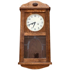 horloge murale allemande du 20e siècle en noyer réglementaire et mécanique