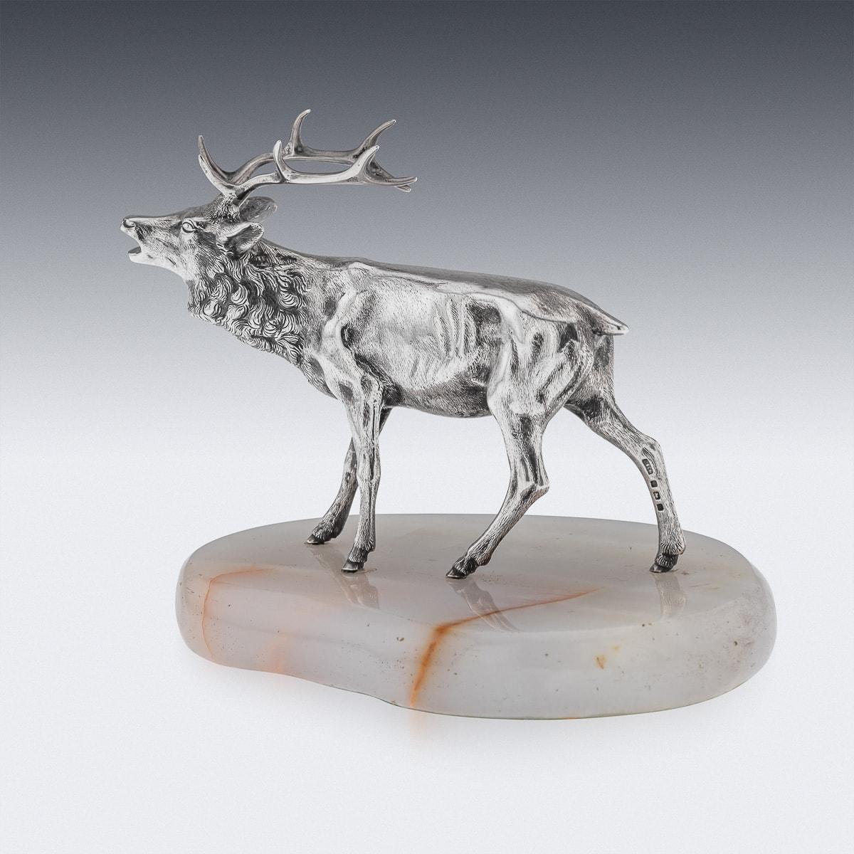 Antique 20th Century solid silver table ornament in the form of a stag standing on an oval stone base. Hallmarked English silver marks (925 standard), Birmingham, year 1921 (w), Makers mark C&CH (C & C Hodgetts).